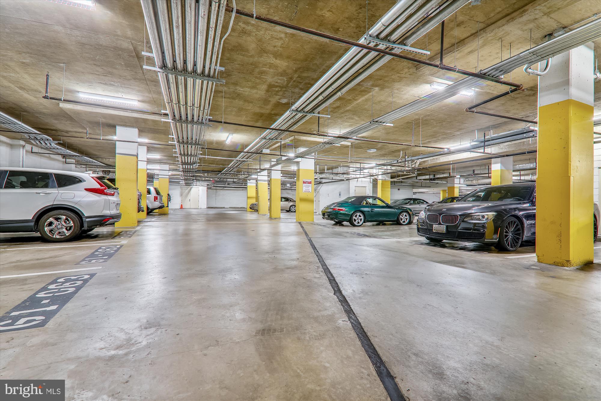 1390 Kenyon Street Northwest, Unit 416 Washington, DC 20010 - Photo 51 of 58 a view of parking garage with cars parked
