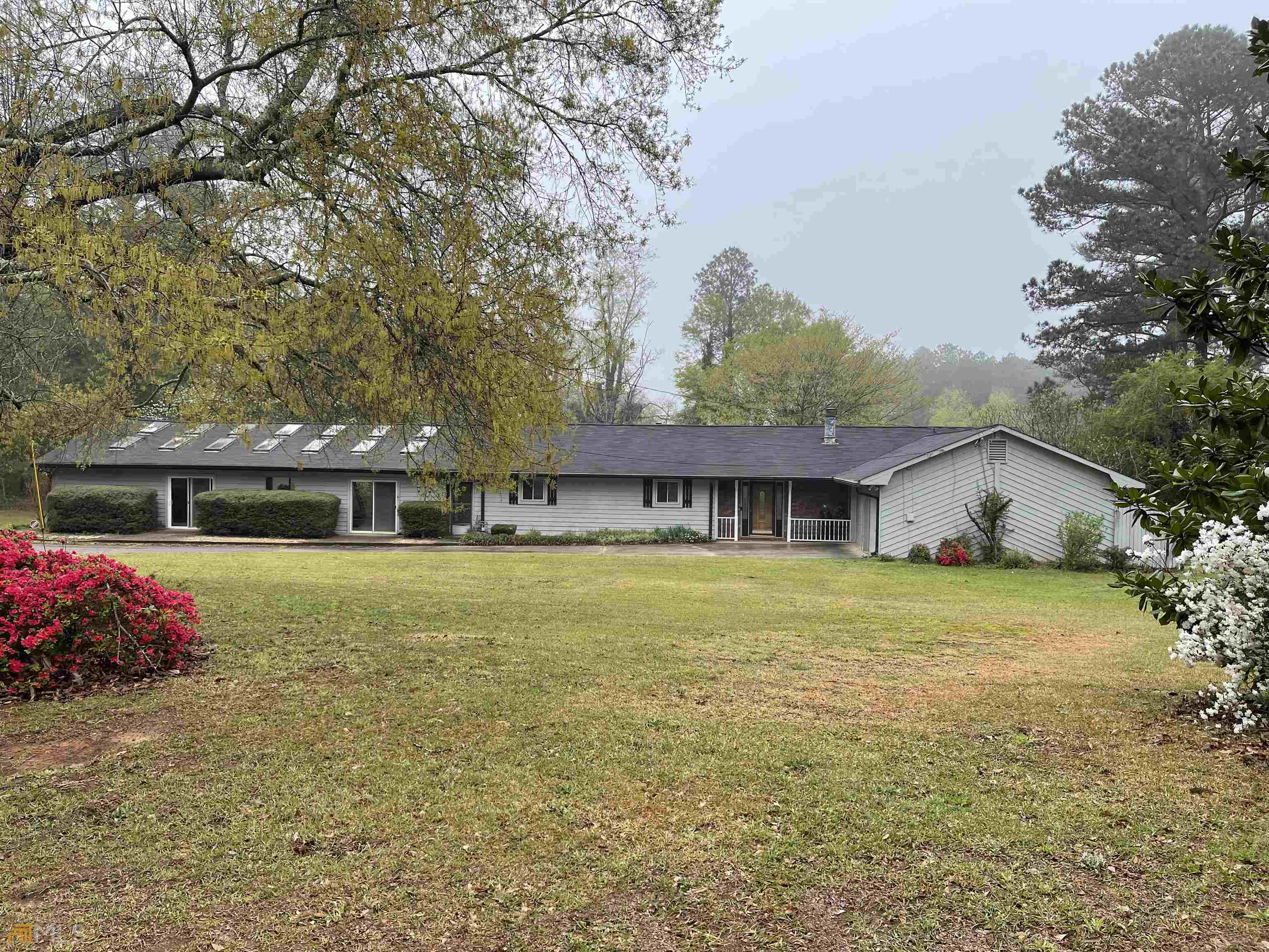 258 Valley Hill Road Stockbridge, GA 30281 - Photo 1 of 1 a front view of a house with a garden