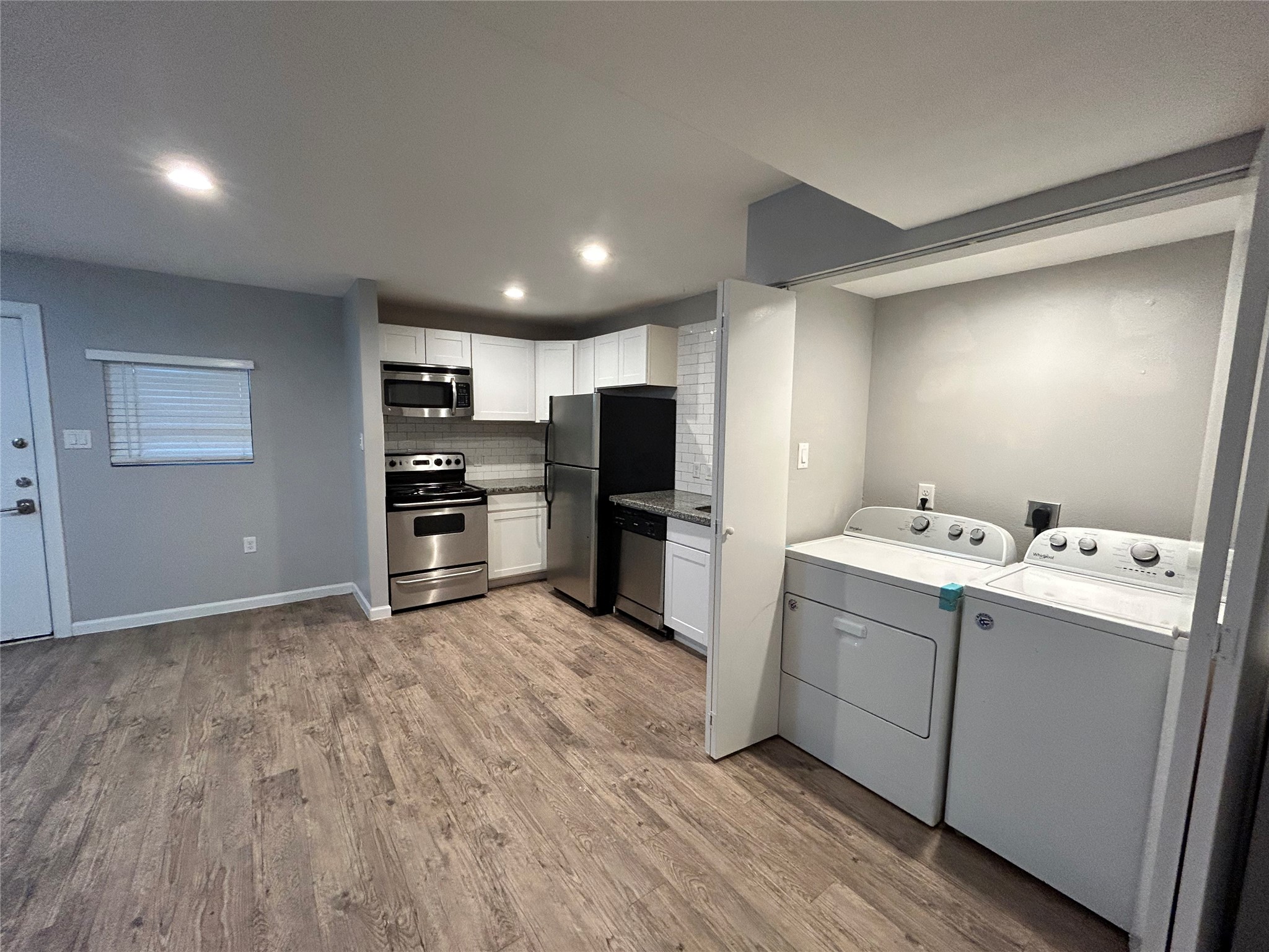 2810 Beauchamp Street, Unit 19 Houston, TX 77009 - Photo 11 of 21 a view of kitchen with refrigerator and microwave