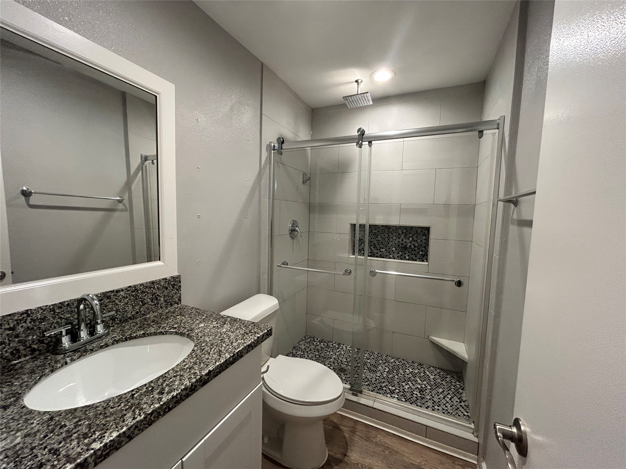 2810 Beauchamp Street, Unit 19 Houston, TX 77009 - Photo 14 of 21 a bathroom with a granite countertop toilet sink shower and mirror