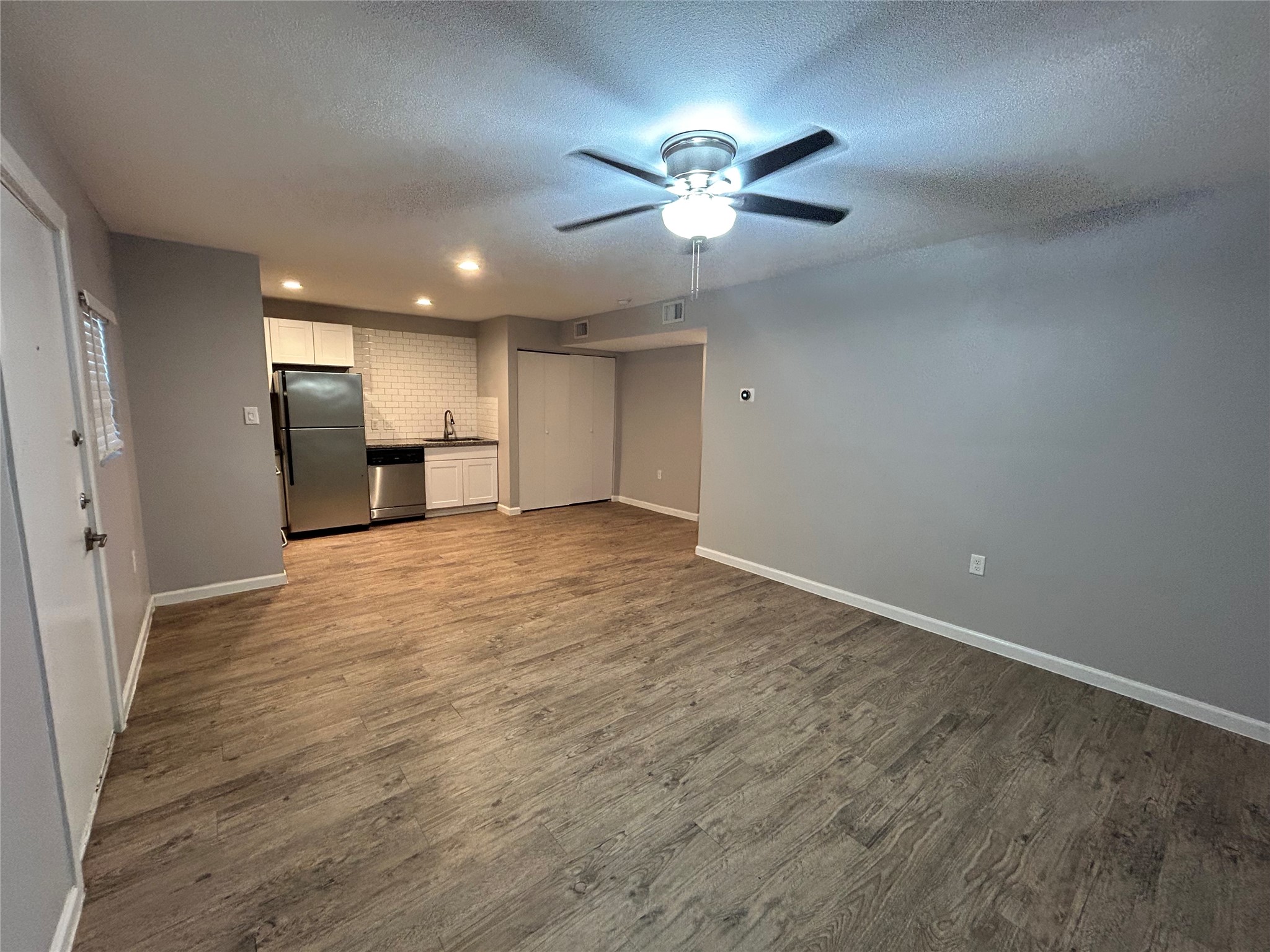 2810 Beauchamp Street, Unit 19 Houston, TX 77009 - Photo 7 of 21 a view of an empty room with a chandelier fan
