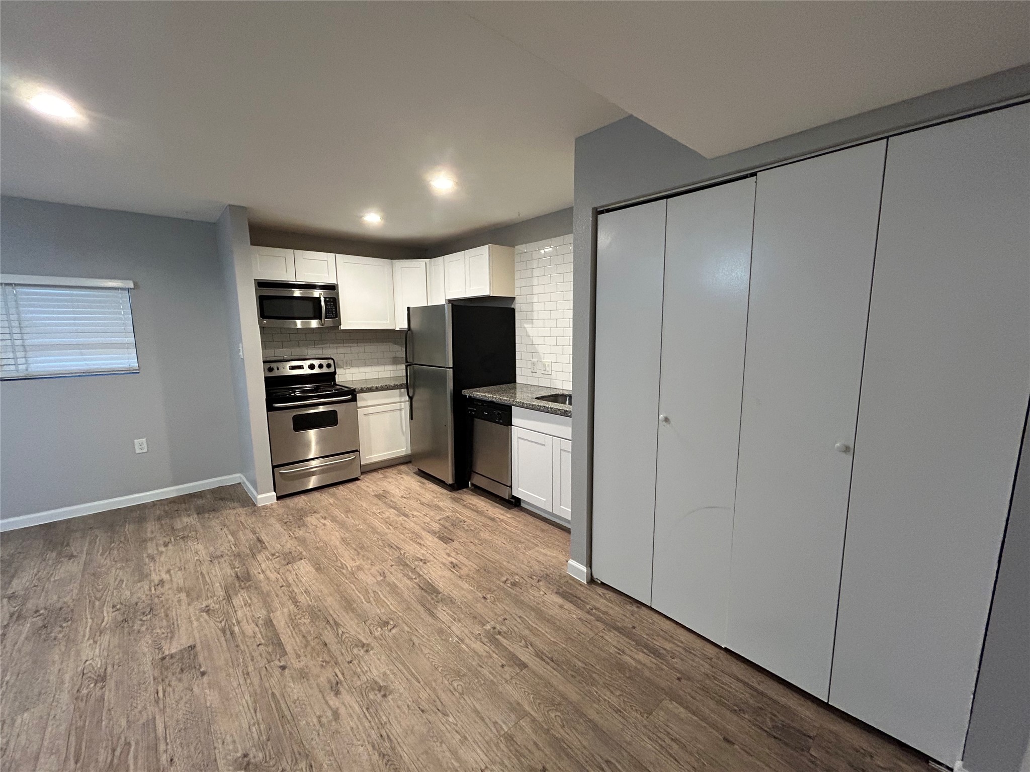 2810 Beauchamp Street, Unit 19 Houston, TX 77009 - Photo 10 of 21 a view of a kitchen with a refrigerator a stove top oven