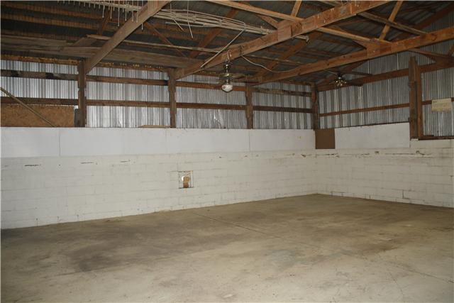 115 Sears Roebuck Road Tullahoma, TN 37388 - Photo 13 of 18 Inside the enormous 32x32 building. What will your plans be for this area? There is also a 2 car overhang outside the shop