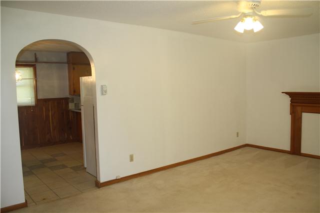 115 Sears Roebuck Road Tullahoma, TN 37388 - Photo 3 of 18 Large living room/family room with arched opening to kitchen/dining area