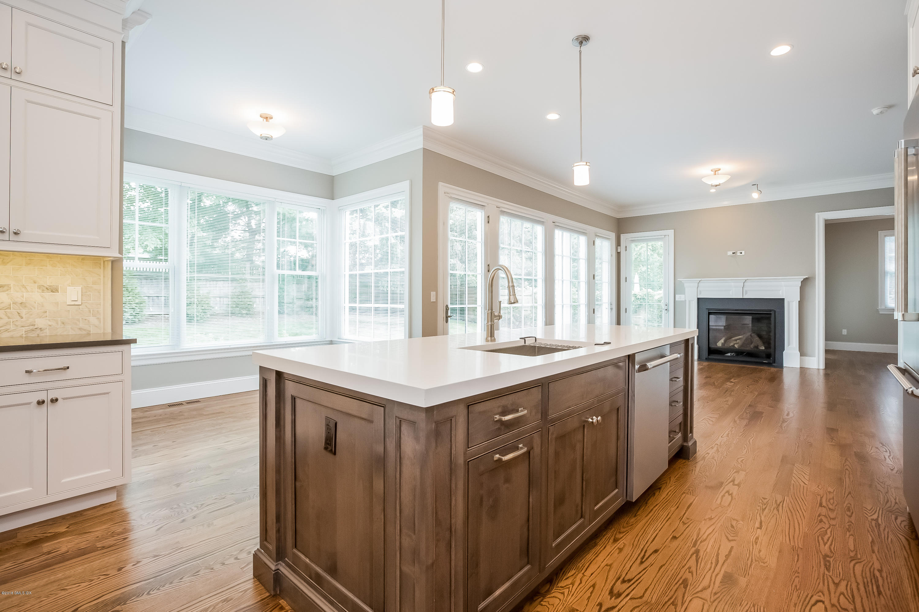 14 Palmer Terrace Riverside, CT 06878 - Photo 12 of 33 a large kitchen with kitchen island granite countertop a large window a sink and stainless steel appliances