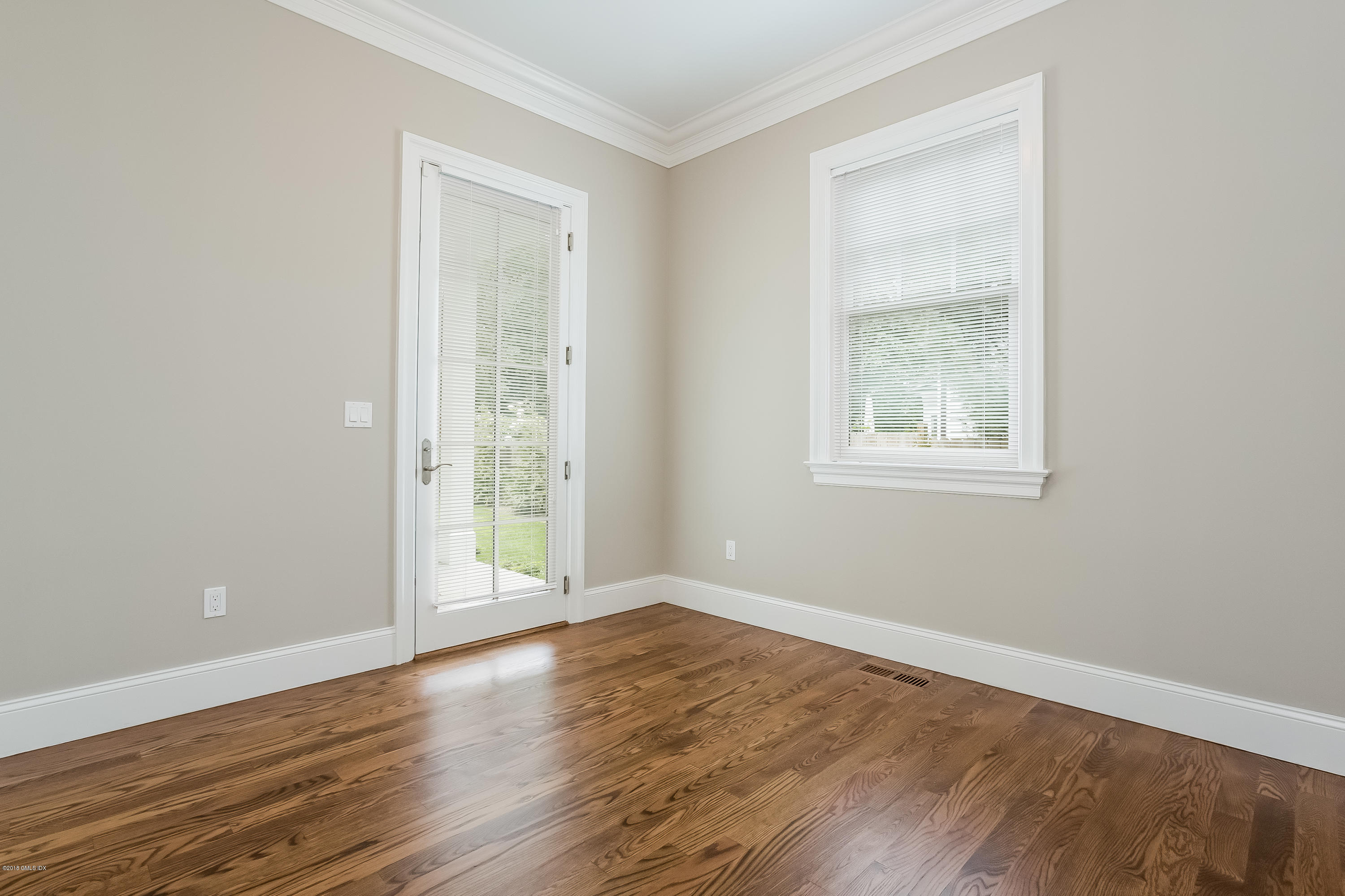 14 Palmer Terrace Riverside, CT 06878 - Photo 17 of 33 an empty room with wooden floor and windows