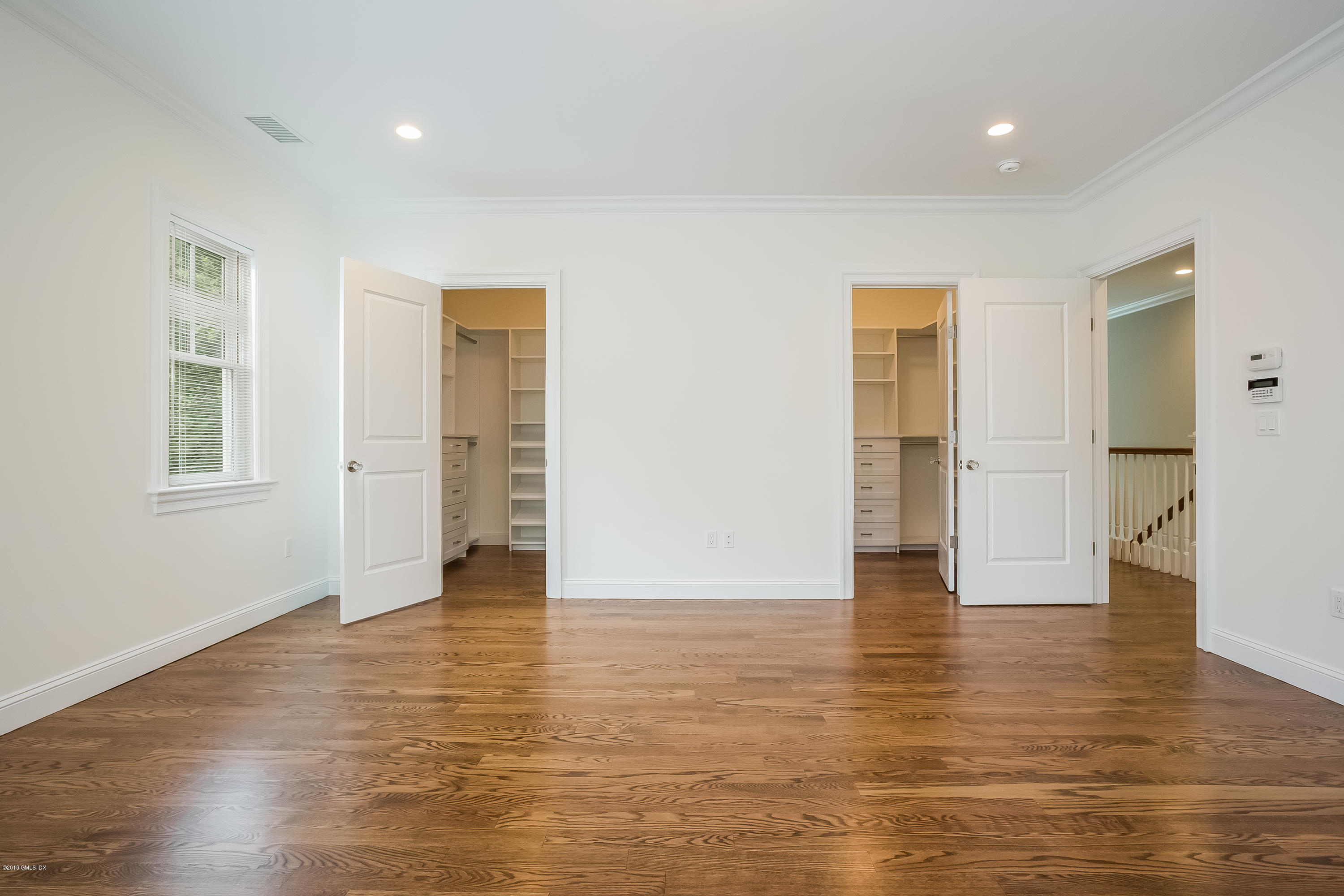 14 Palmer Terrace Riverside, CT 06878 - Photo 18 of 33 a view of an empty room with wooden floor and windows