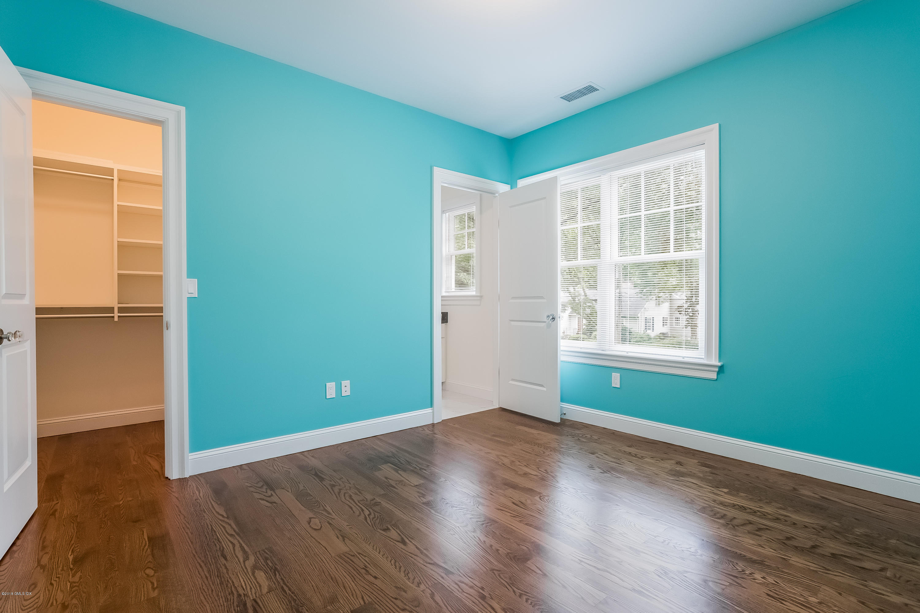 14 Palmer Terrace Riverside, CT 06878 - Photo 22 of 33 an empty room with wooden floor and windows