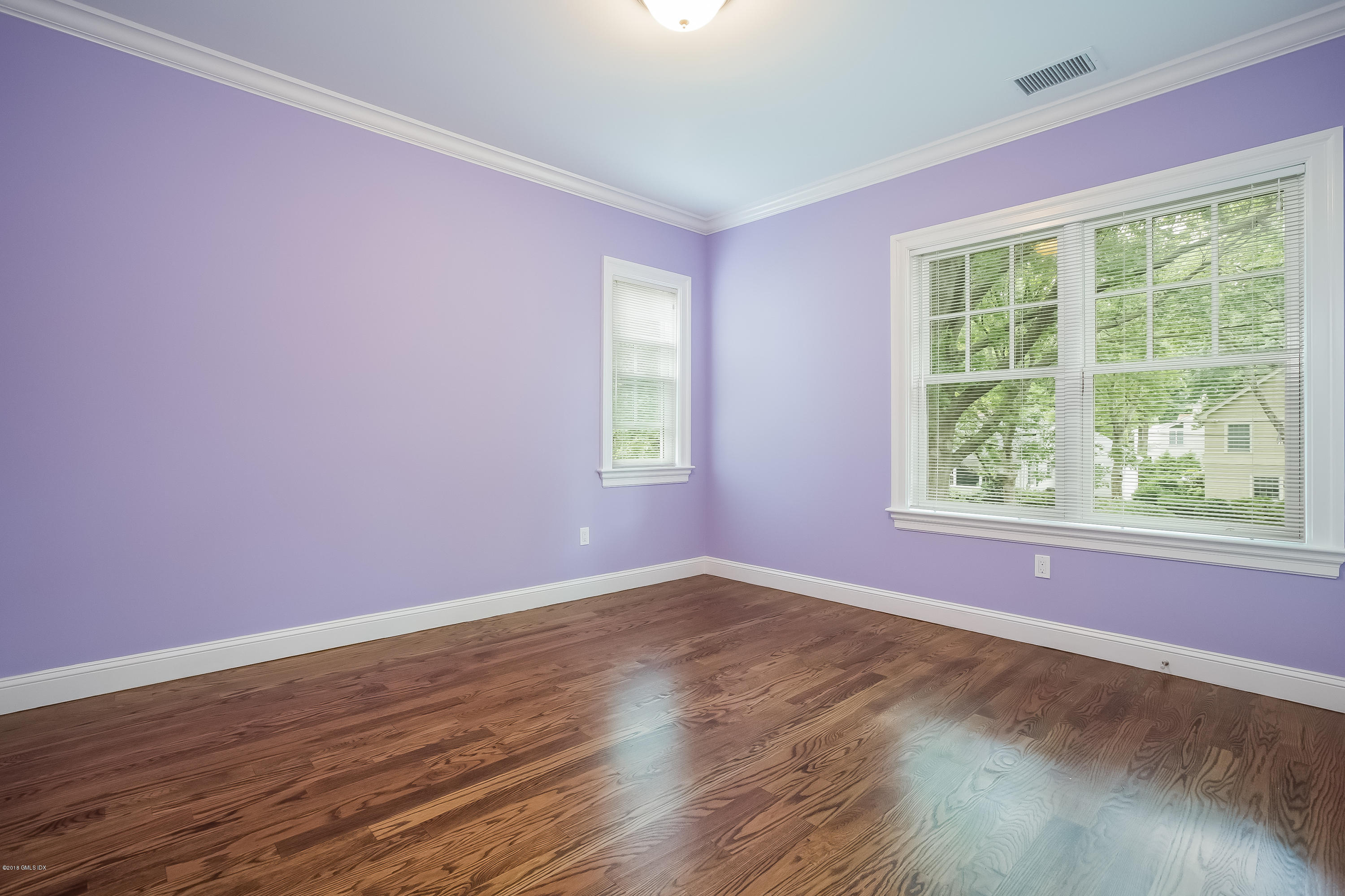 14 Palmer Terrace Riverside, CT 06878 - Photo 23 of 33 a view of an empty room with wooden floor and a window