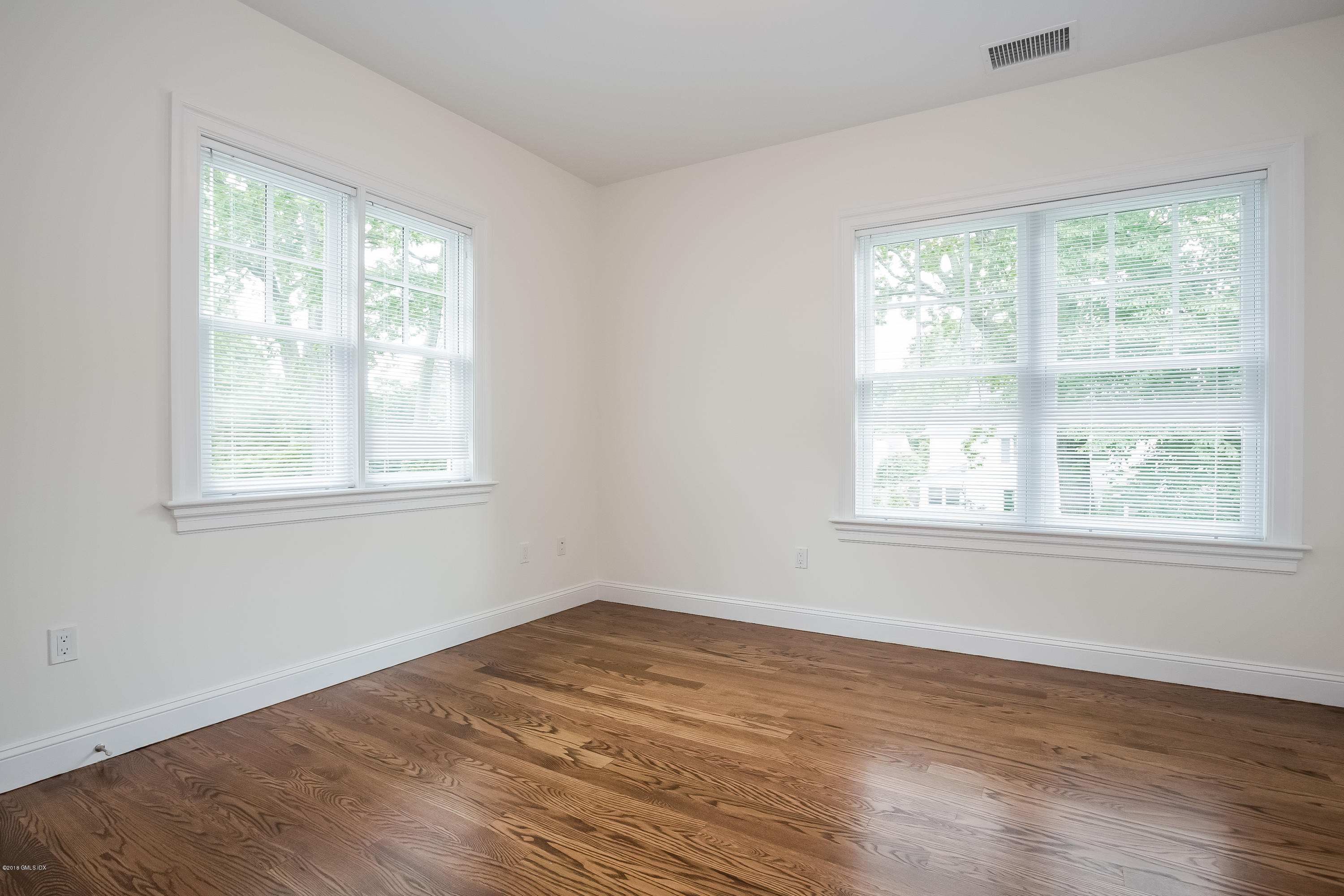 14 Palmer Terrace Riverside, CT 06878 - Photo 24 of 33 a view of a room with wooden floor and windows