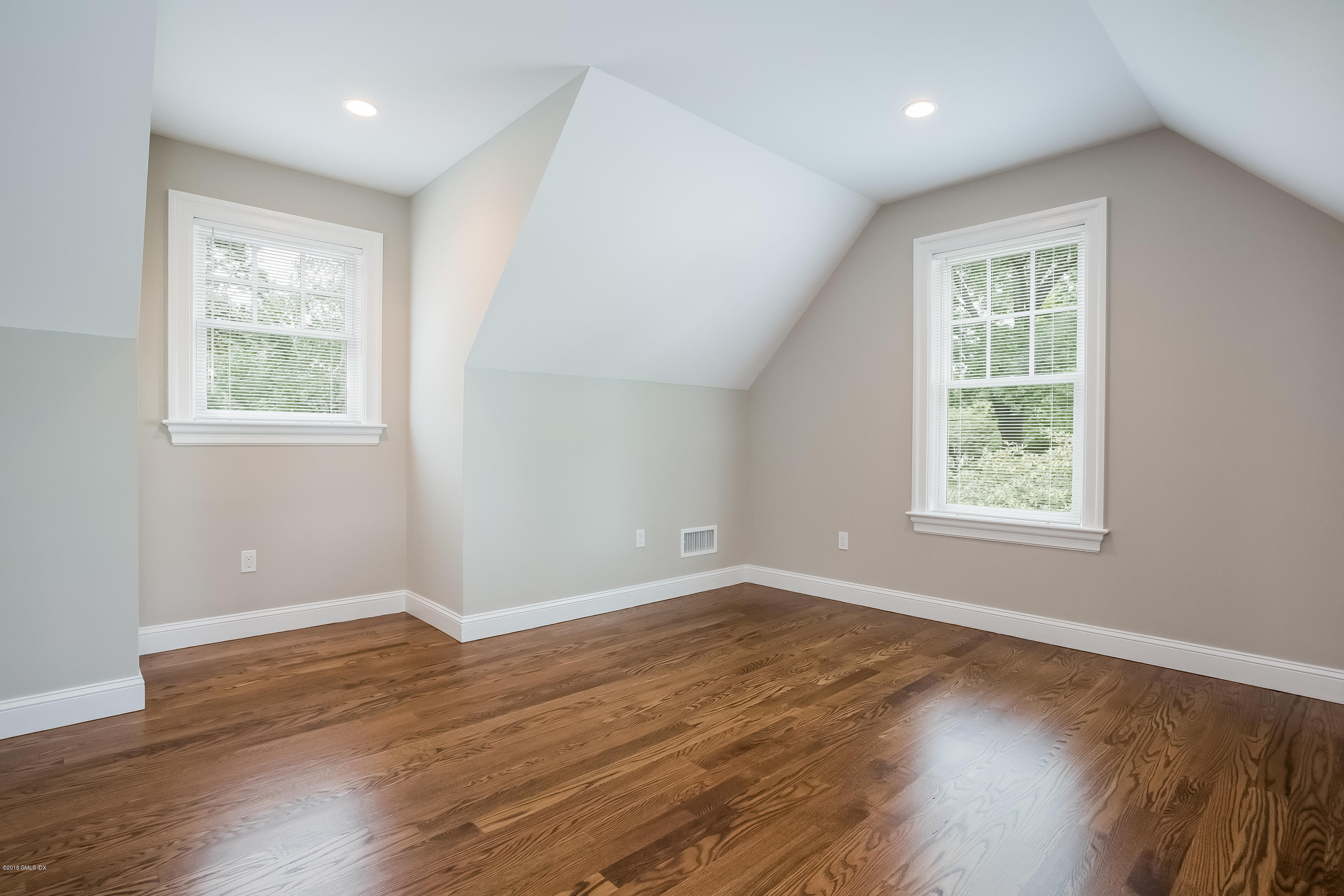 14 Palmer Terrace Riverside, CT 06878 - Photo 25 of 33 a view of an empty room with wooden floor and a window