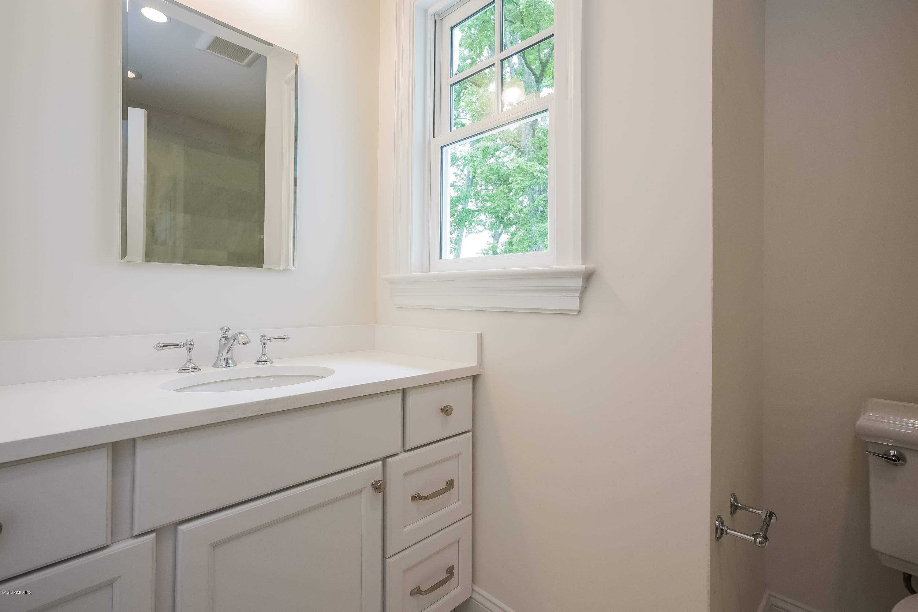 14 Palmer Terrace Riverside, CT 06878 - Photo 26 of 33 a bathroom with a sink and a mirror