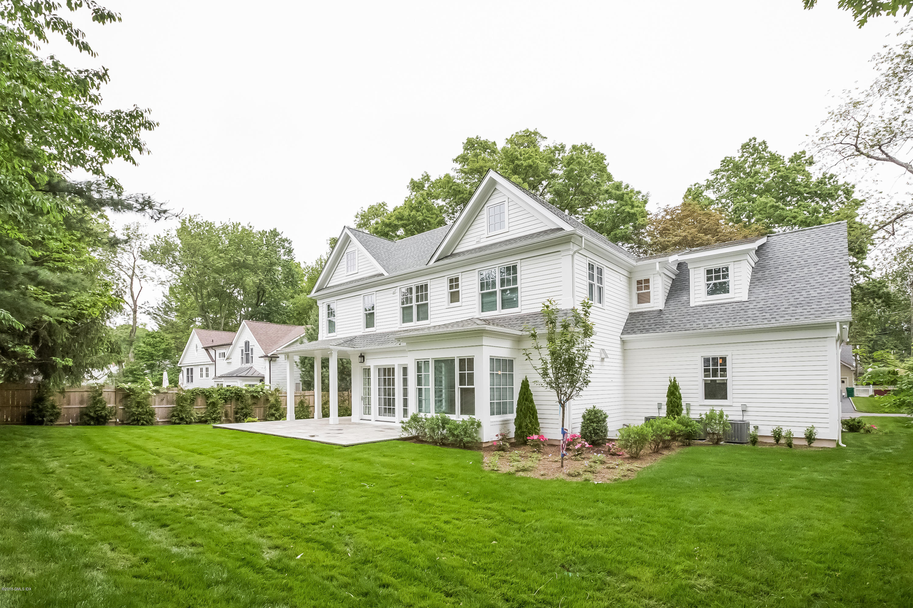 14 Palmer Terrace Riverside, CT 06878 - Photo 32 of 33 a front view of a house with a garden and porch
