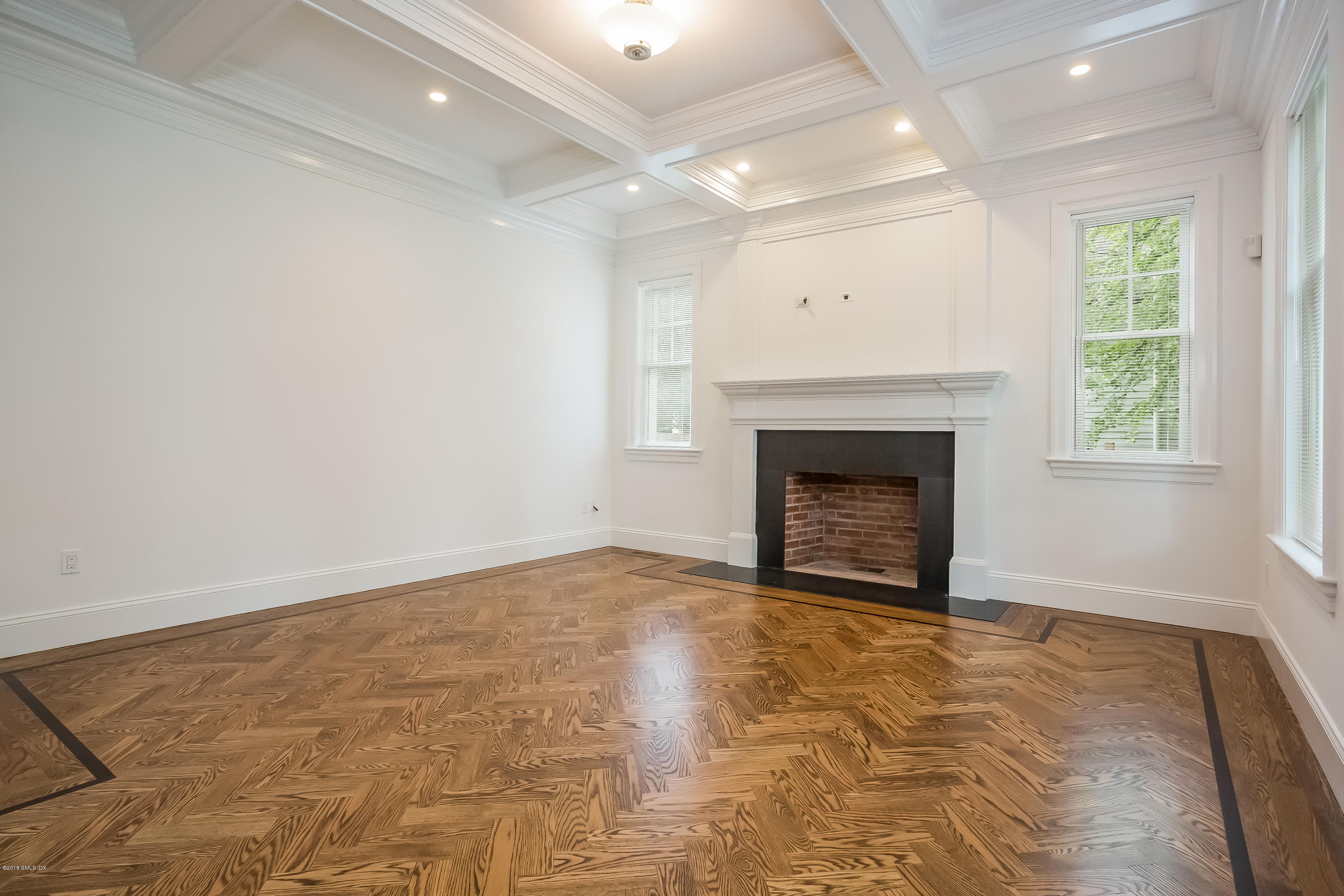 14 Palmer Terrace Riverside, CT 06878 - Photo 6 of 33 an empty room with a fireplace and window