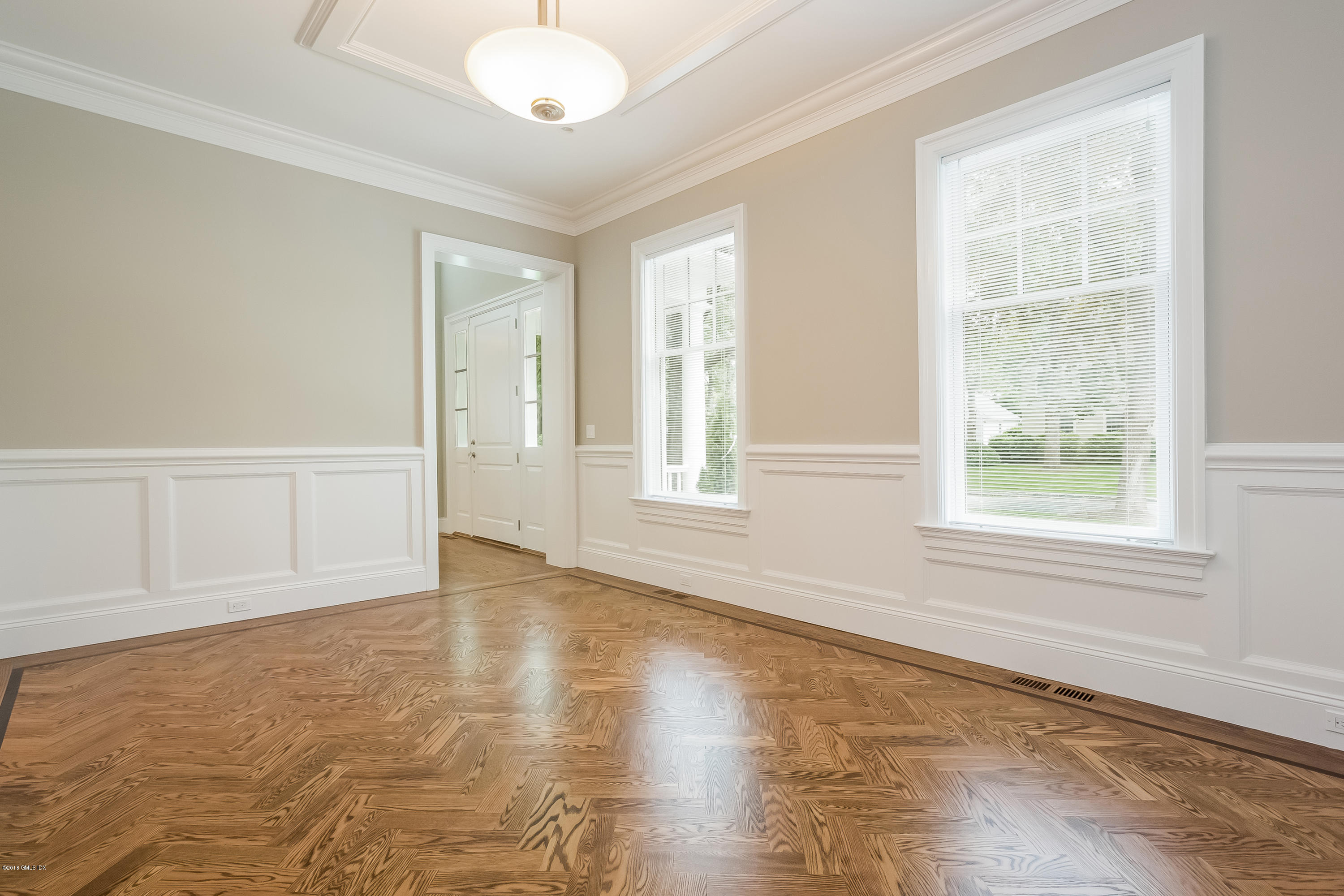 14 Palmer Terrace Riverside, CT 06878 - Photo 9 of 33 an empty room with wooden floor and windows