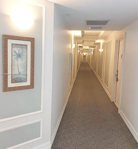 a view of a patio with chairs and a table and chairs