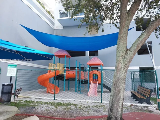 a view of a patio with dining table and chairs with plants