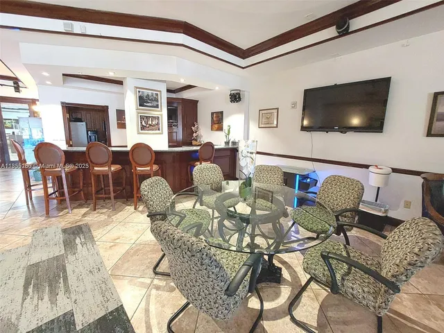 a view of an empty room with floor to ceiling windows