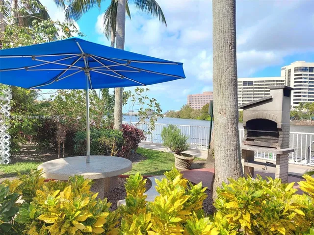 a view of a swimming pool with outdoor seating