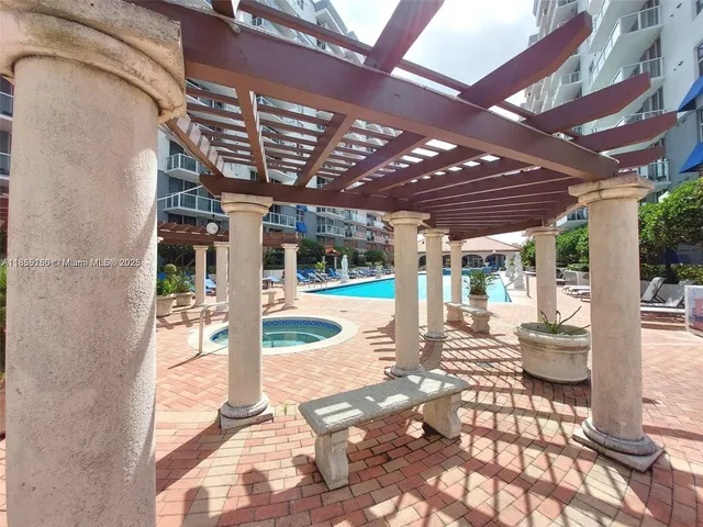 a view of a hallway with entryway door