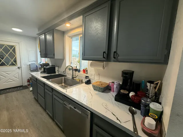 a kitchen with a sink and cabinets