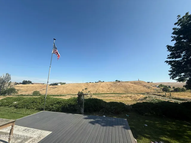 a view of a street with an ocean view
