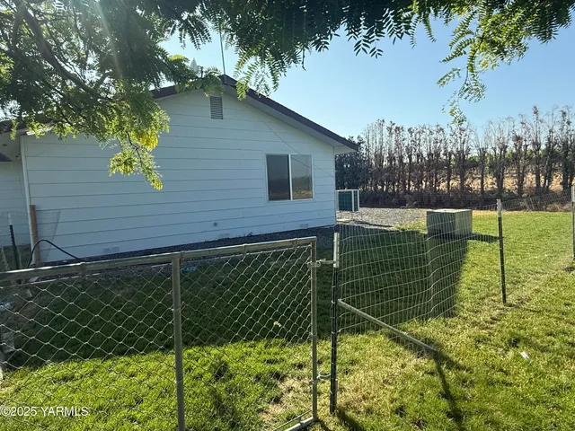 a brick building with a yard