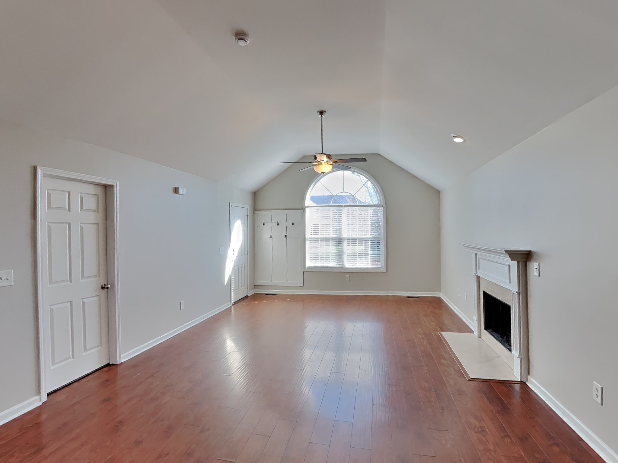 1721 Stephenson Lane Spring Hill, TN 37174 - Photo 3 of 16 an empty room with wooden floor cabinet and windows