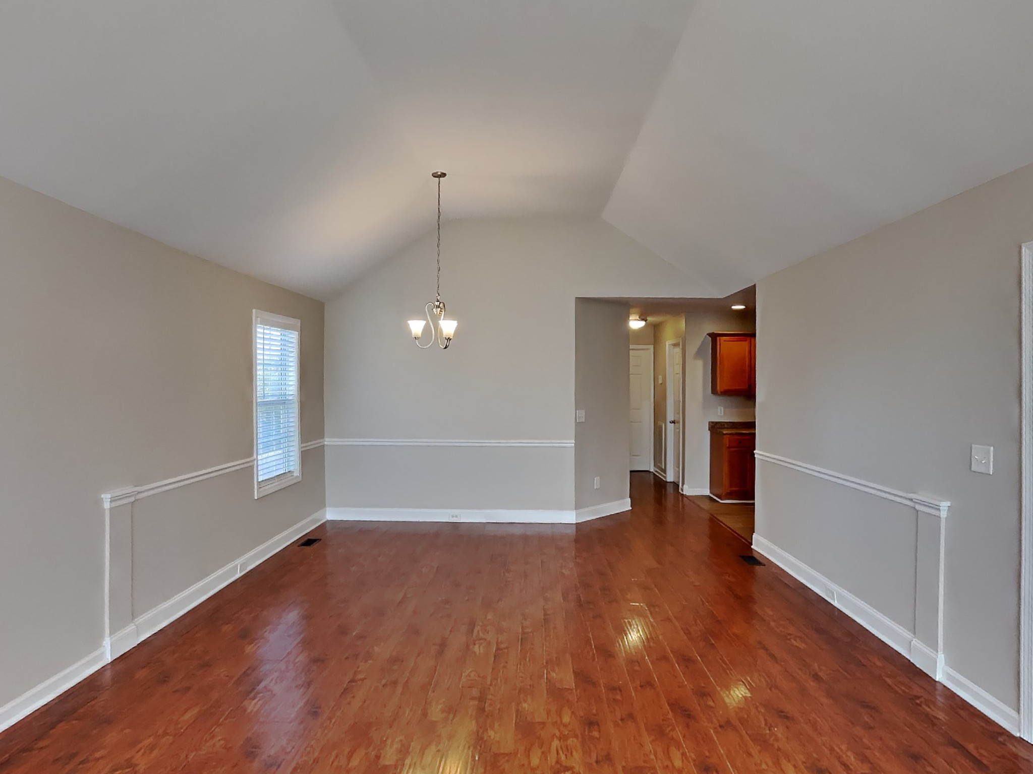 1721 Stephenson Lane Spring Hill, TN 37174 - Photo 4 of 16 an empty room with wooden floor and entrance