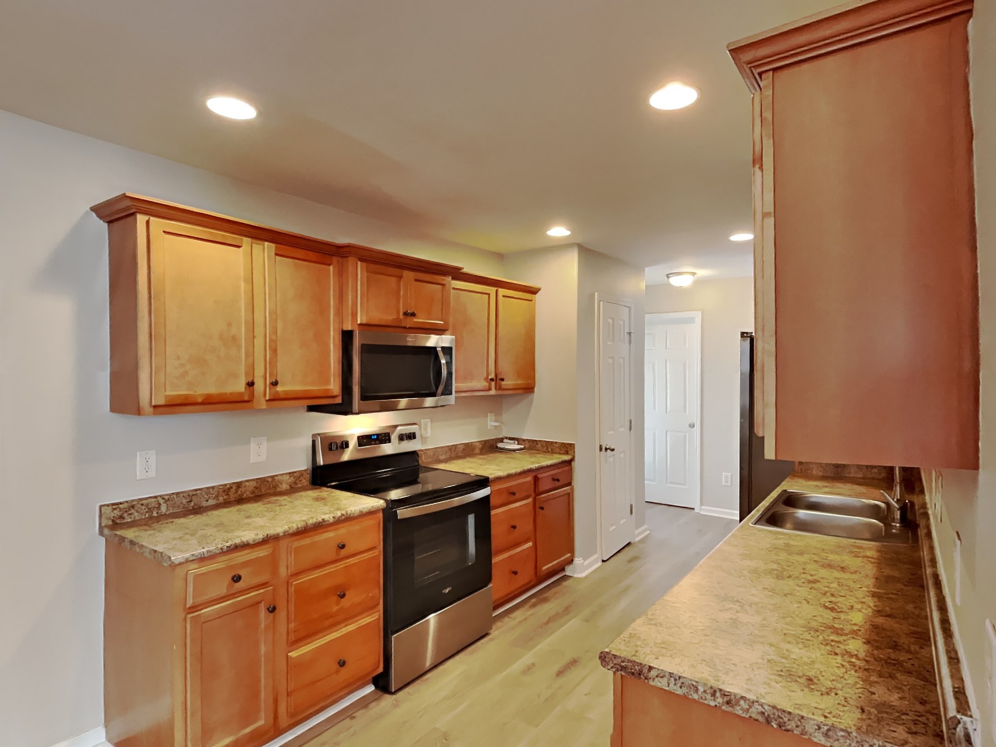 1721 Stephenson Lane Spring Hill, TN 37174 - Photo 5 of 16 a kitchen with a stove a sink and a refrigerator
