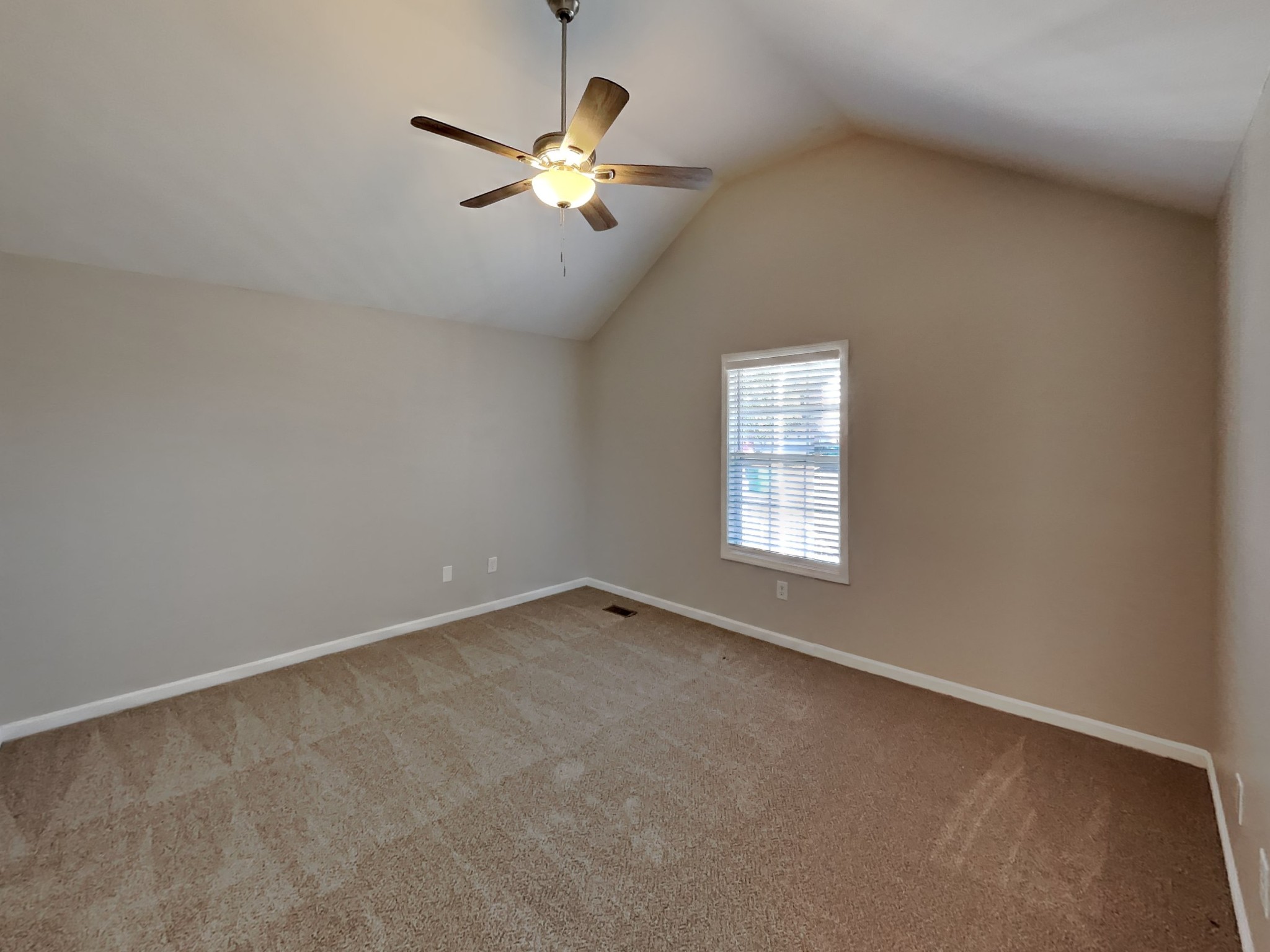 1721 Stephenson Lane Spring Hill, TN 37174 - Photo 6 of 16 an empty room with a chandelier fan and windows