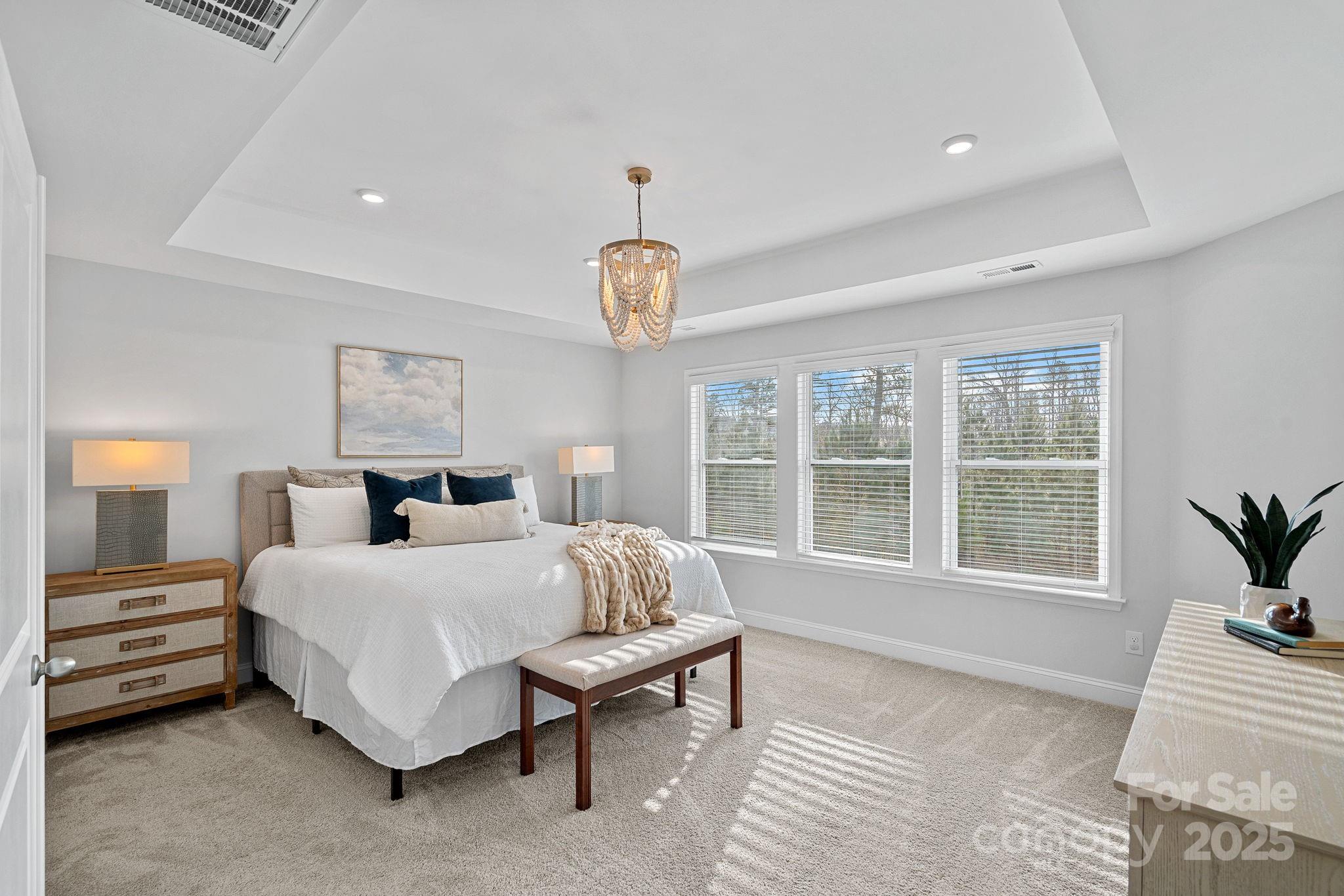2253 Masons Bend Drive Fort Mill, SC 29708 - Photo 23 of 48 a bedroom with a large bed and a large window