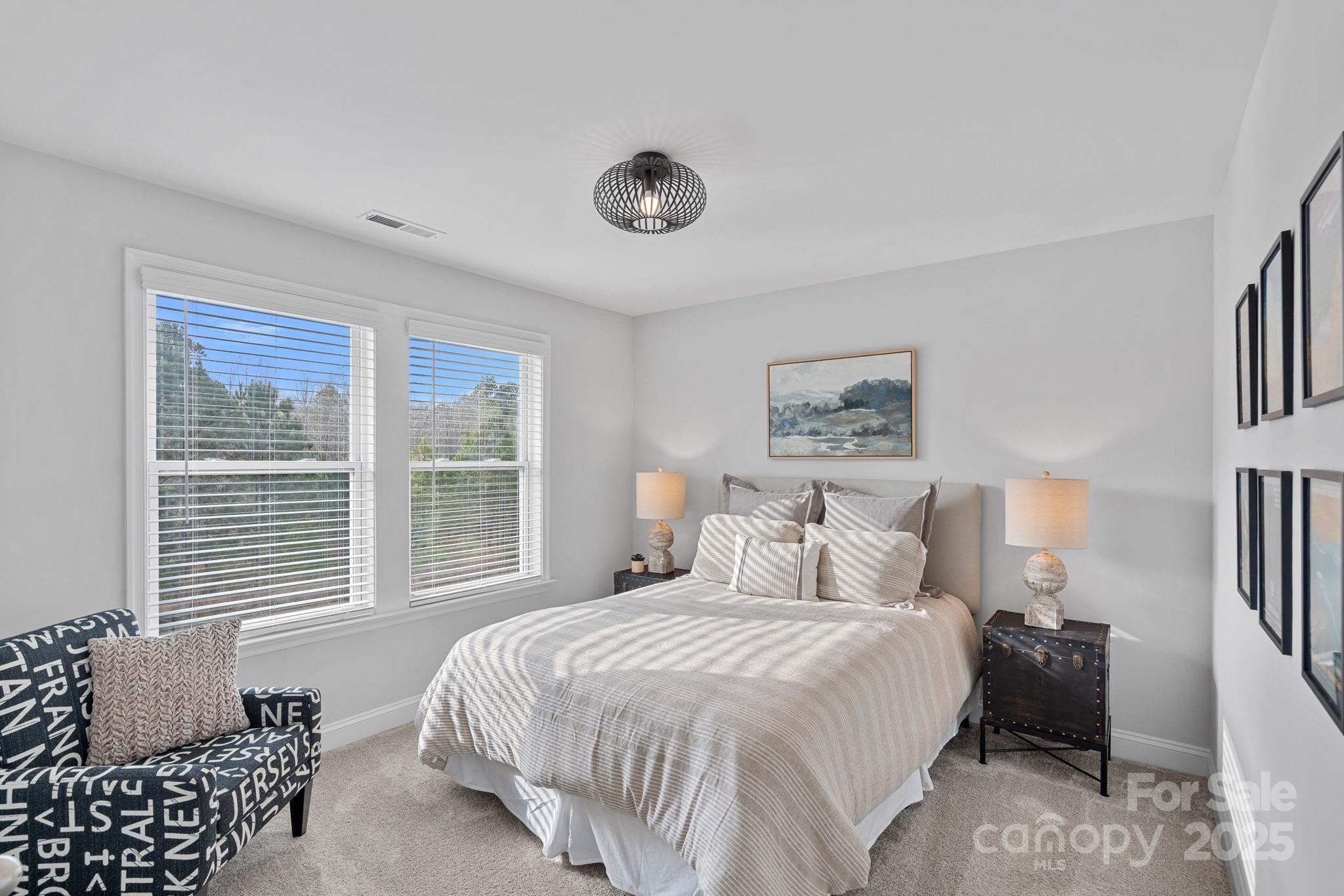 2253 Masons Bend Drive Fort Mill, SC 29708 - Photo 28 of 48 a bedroom with a bed and a window