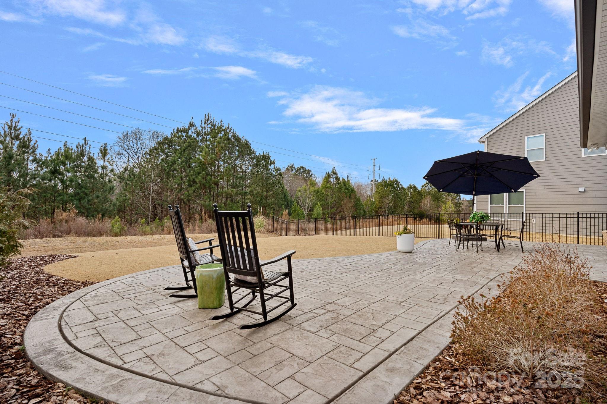 2253 Masons Bend Drive Fort Mill, SC 29708 - Photo 39 of 48 a roof deck with table and chairs under an umbrella