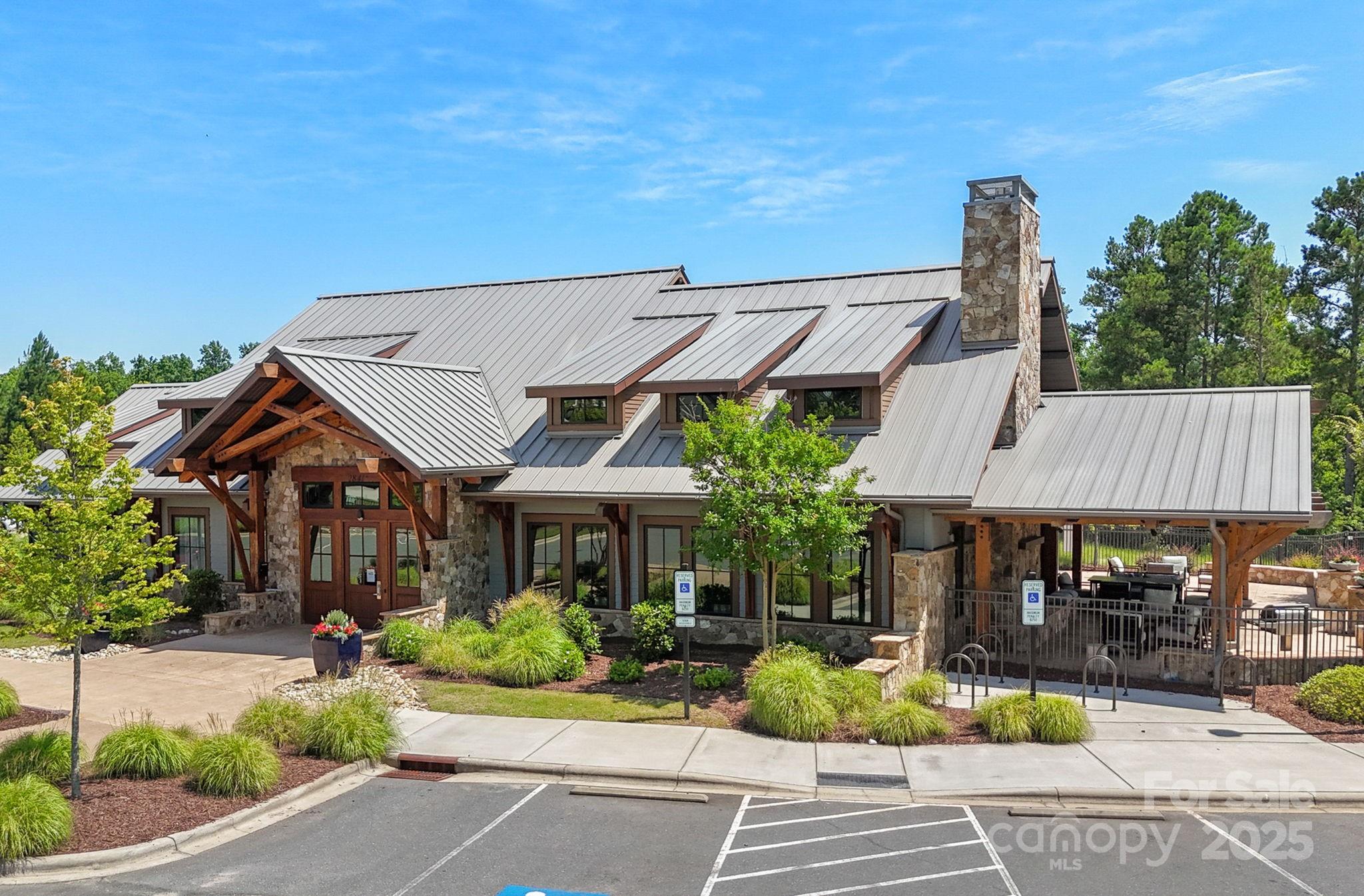 2253 Masons Bend Drive Fort Mill, SC 29708 - Photo 44 of 48 a patio with a table and chairs under an umbrella