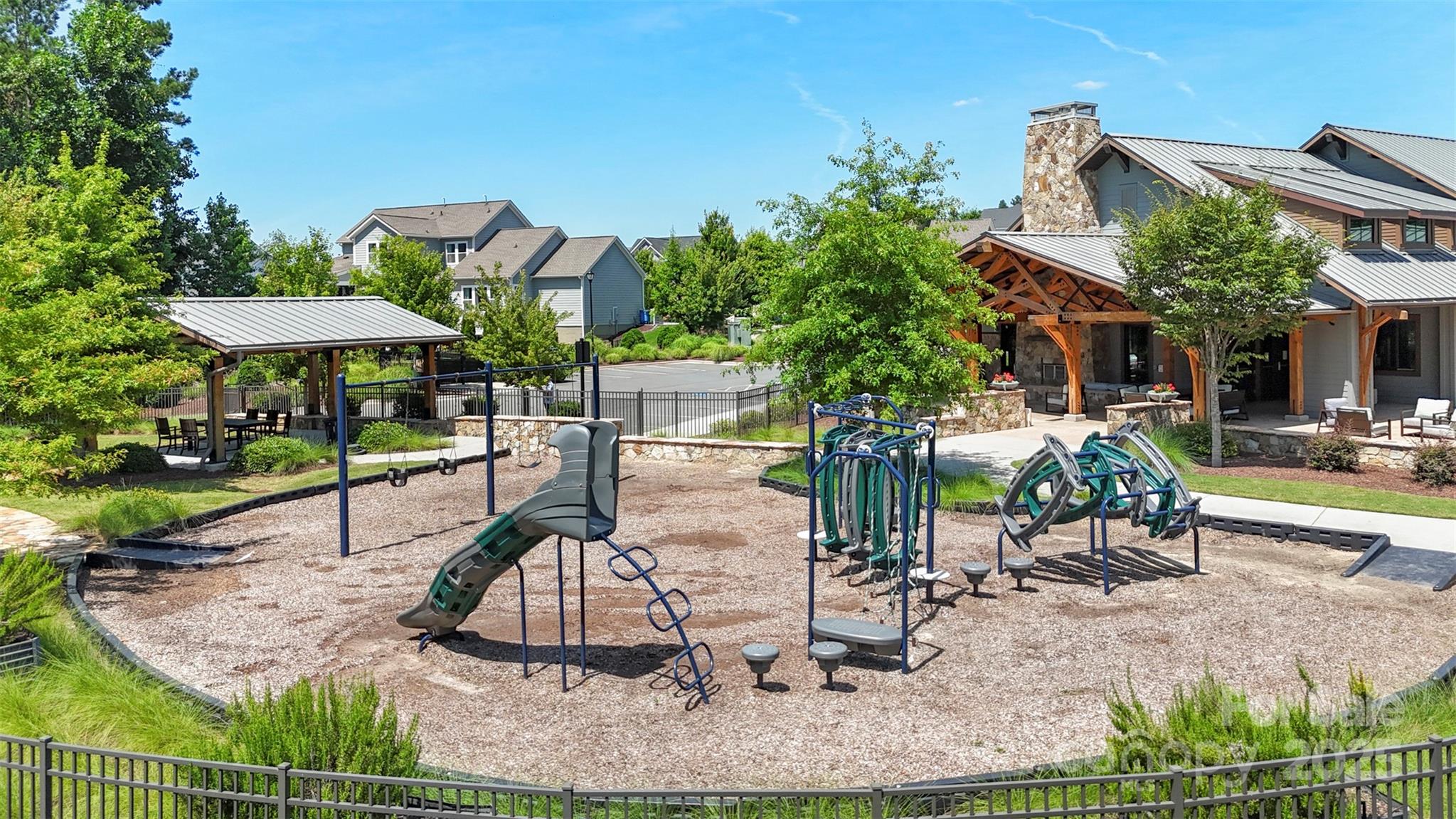 2253 Masons Bend Drive Fort Mill, SC 29708 - Photo 46 of 48 a view of a patio with table and chairs potted plants