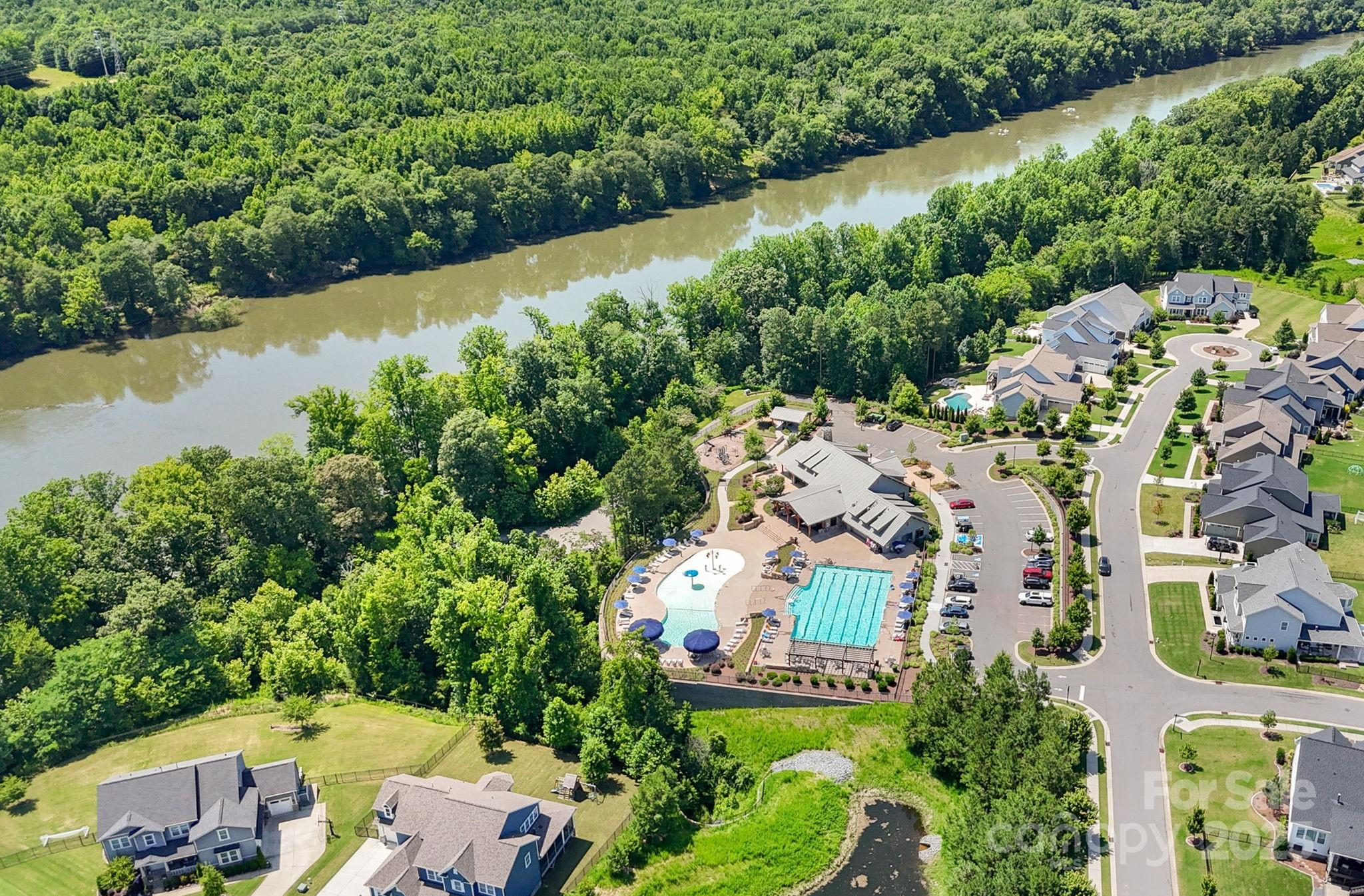 2253 Masons Bend Drive Fort Mill, SC 29708 - Photo 48 of 48 an aerial view of a house with a garden and lake view