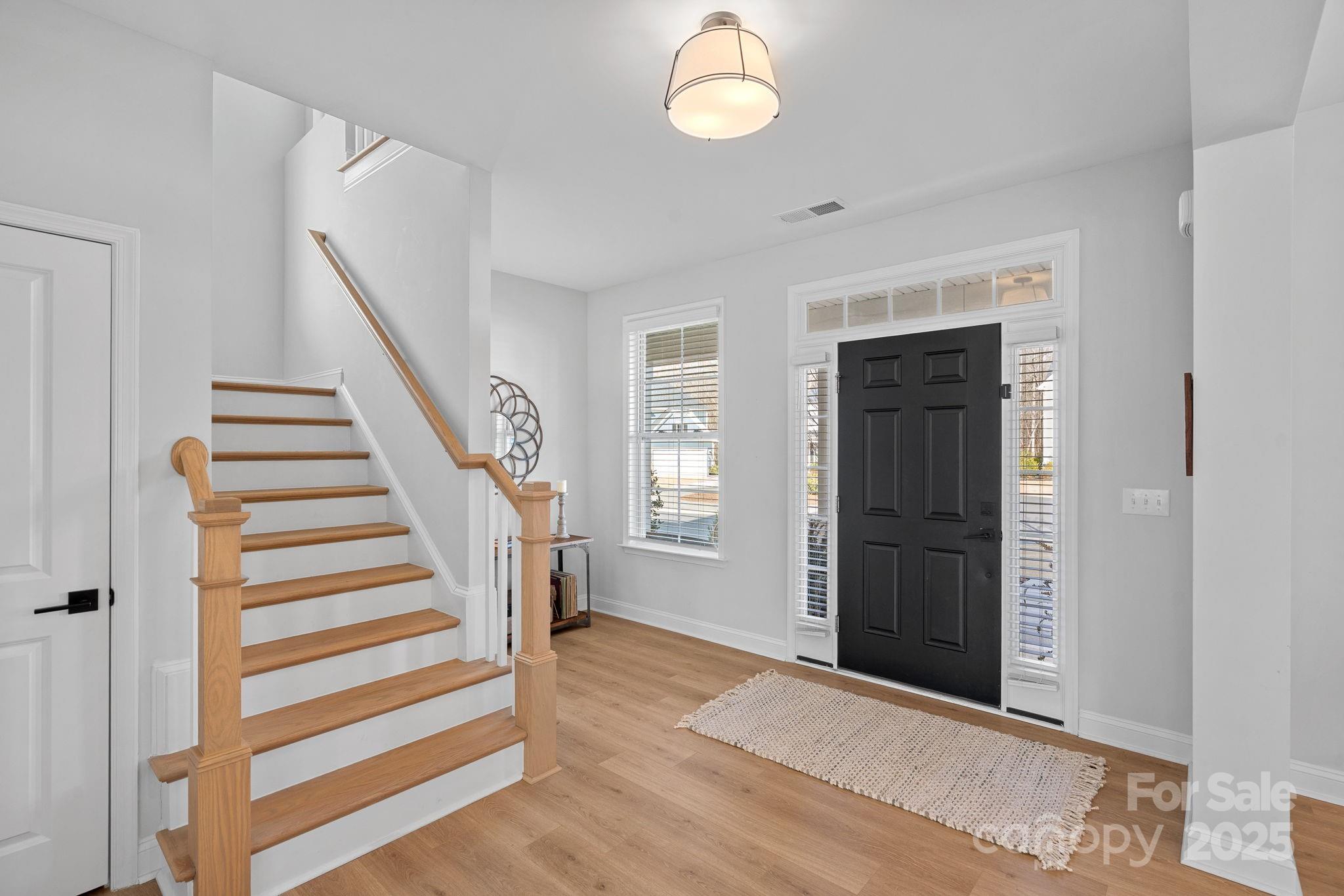 2253 Masons Bend Drive Fort Mill, SC 29708 - Photo 6 of 48 a view of entryway with wooden floor and stairs