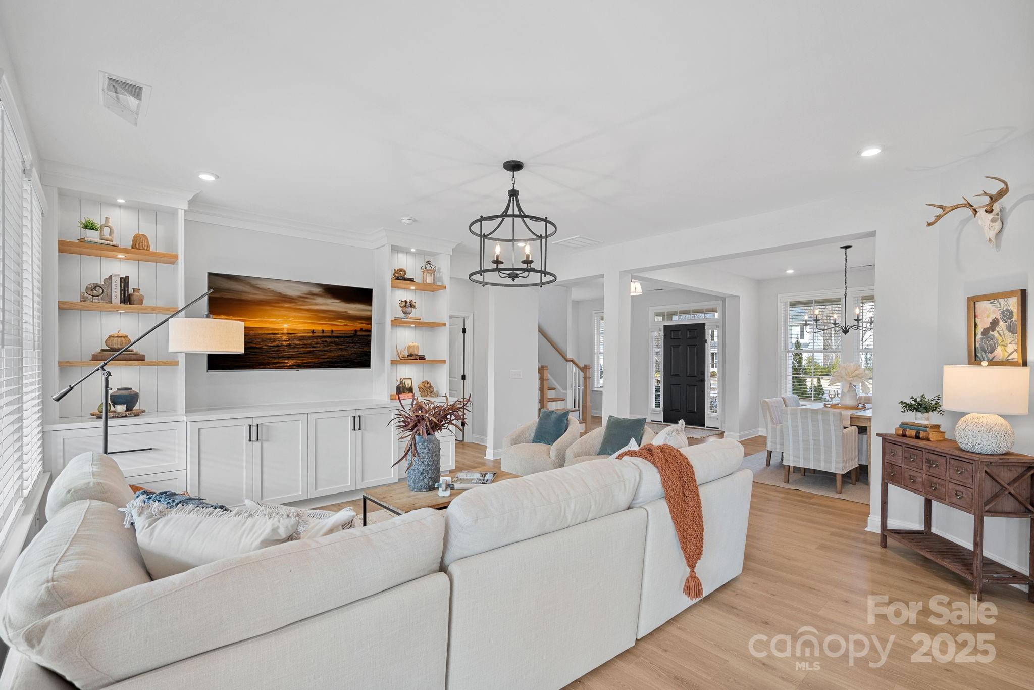 2253 Masons Bend Drive Fort Mill, SC 29708 - Photo 9 of 48 a living room with furniture and a flat screen tv