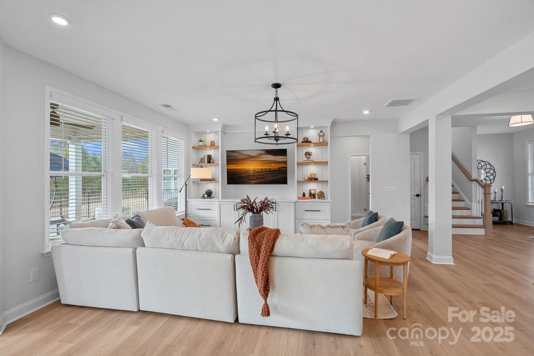 2253 Masons Bend Drive Fort Mill, SC 29708 - Photo 10 of 48 a living room with furniture and a flat screen tv