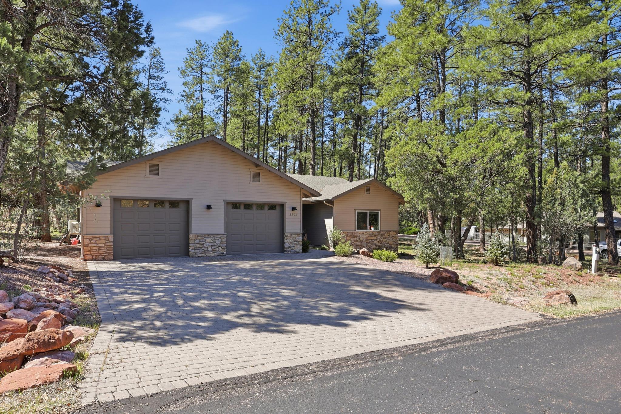 5501 Solitude Trail Loop Pine, AZ 85544 - Photo 2 of 27 a house that has a tree in front of it