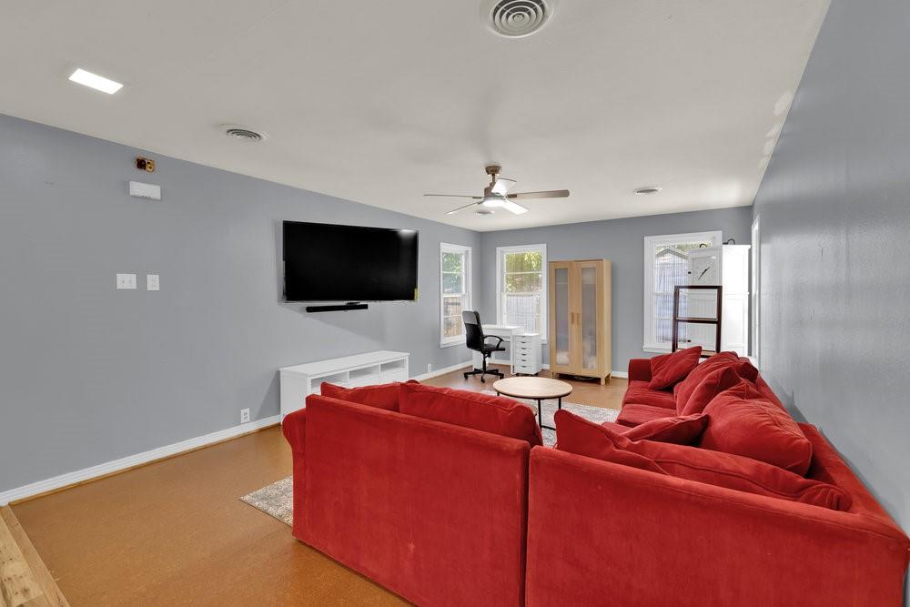 2716 Wayside Avenue Fort Worth, TX 76110 - Photo 13 of 34 a living room with furniture and a flat screen tv