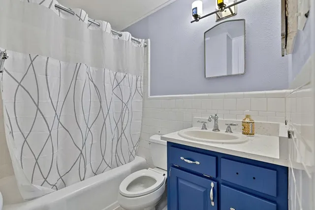 a bathroom with a toilet a sink and a bathtub