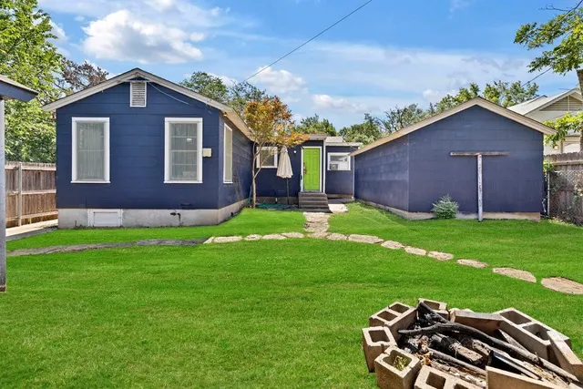 a view of a backyard of a house
