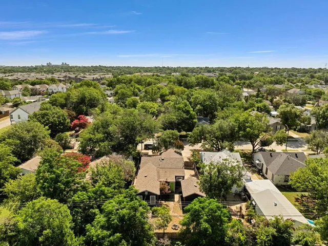 an aerial view of residential house with outdoor space