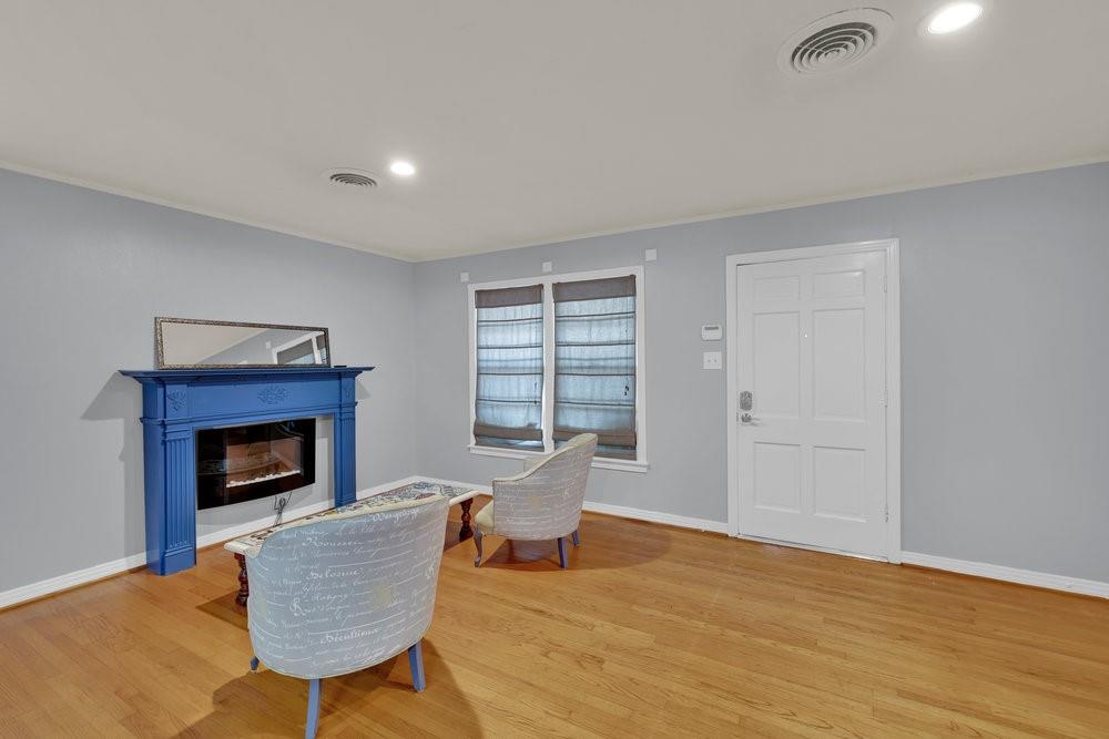 2716 Wayside Avenue Fort Worth, TX 76110 - Photo 8 of 34 a living room with furniture and a fireplace