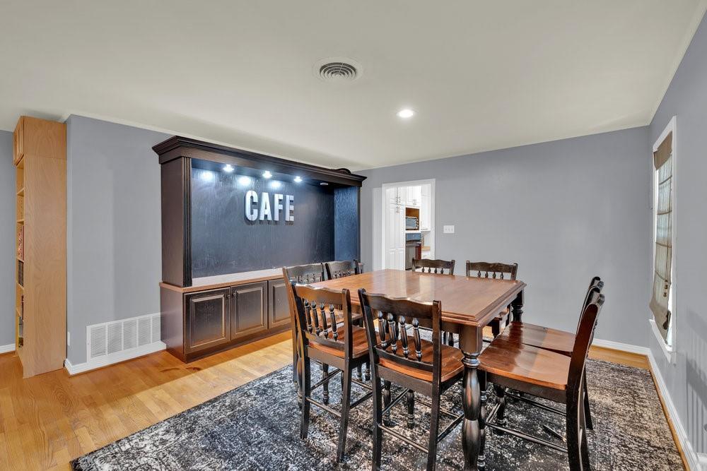 2716 Wayside Avenue Fort Worth, TX 76110 - Photo 9 of 34 a view of a dining room with furniture and wooden floor