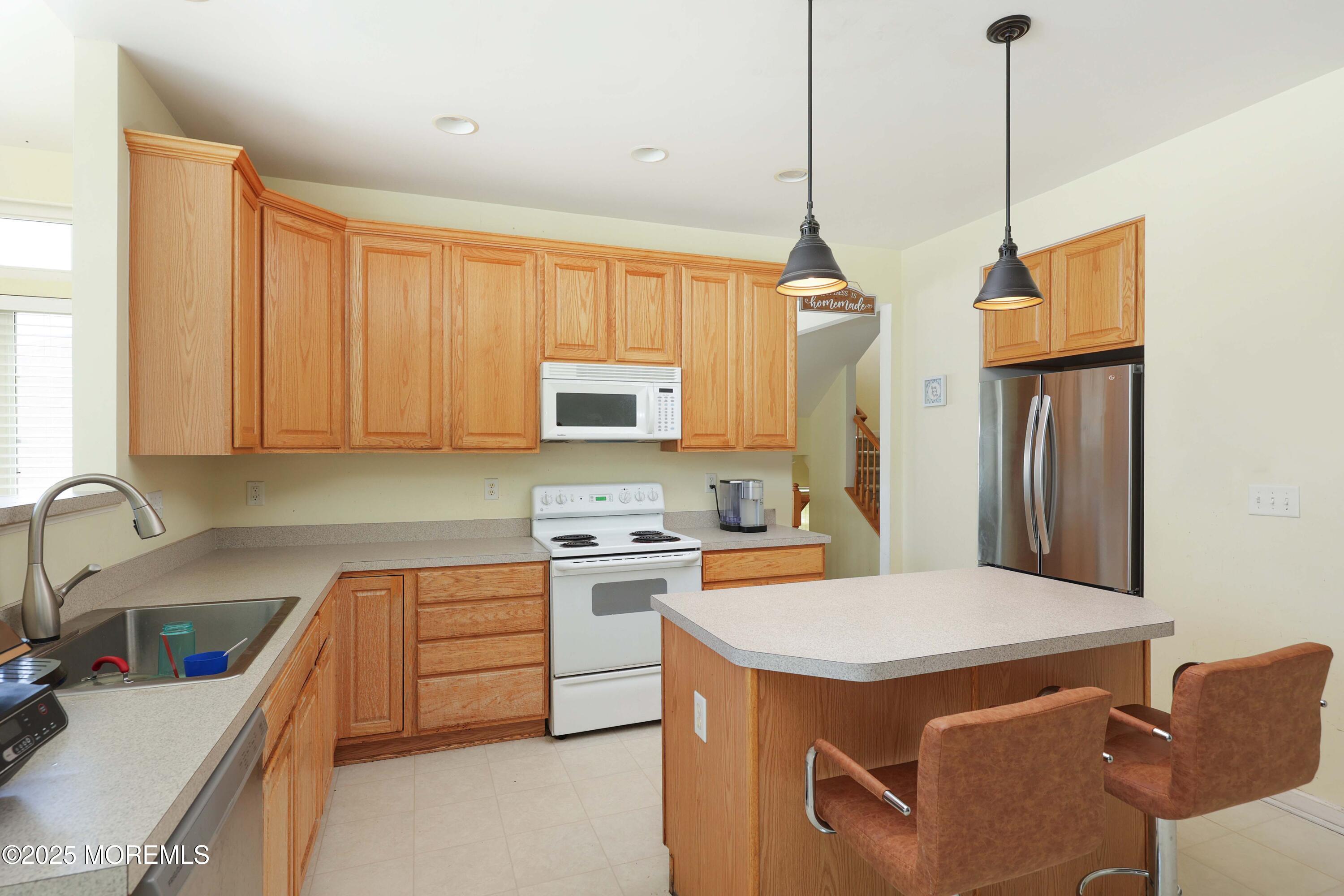 32 Firestone Drive Howell, NJ 07731 - Photo 13 of 43 a kitchen that has a sink a stove and a refrigerator