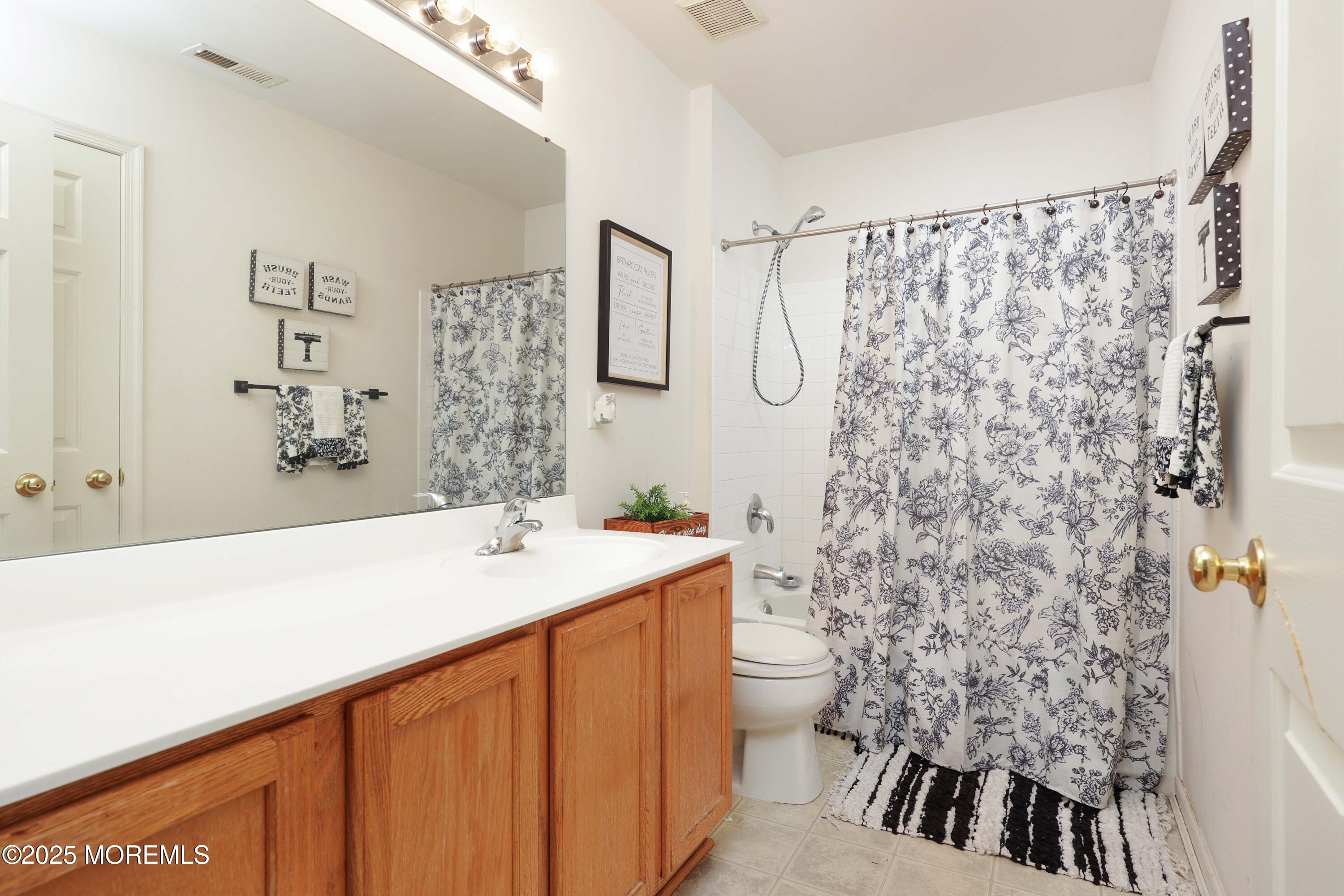 32 Firestone Drive Howell, NJ 07731 - Photo 20 of 43 a bathroom with a sink and a mirror