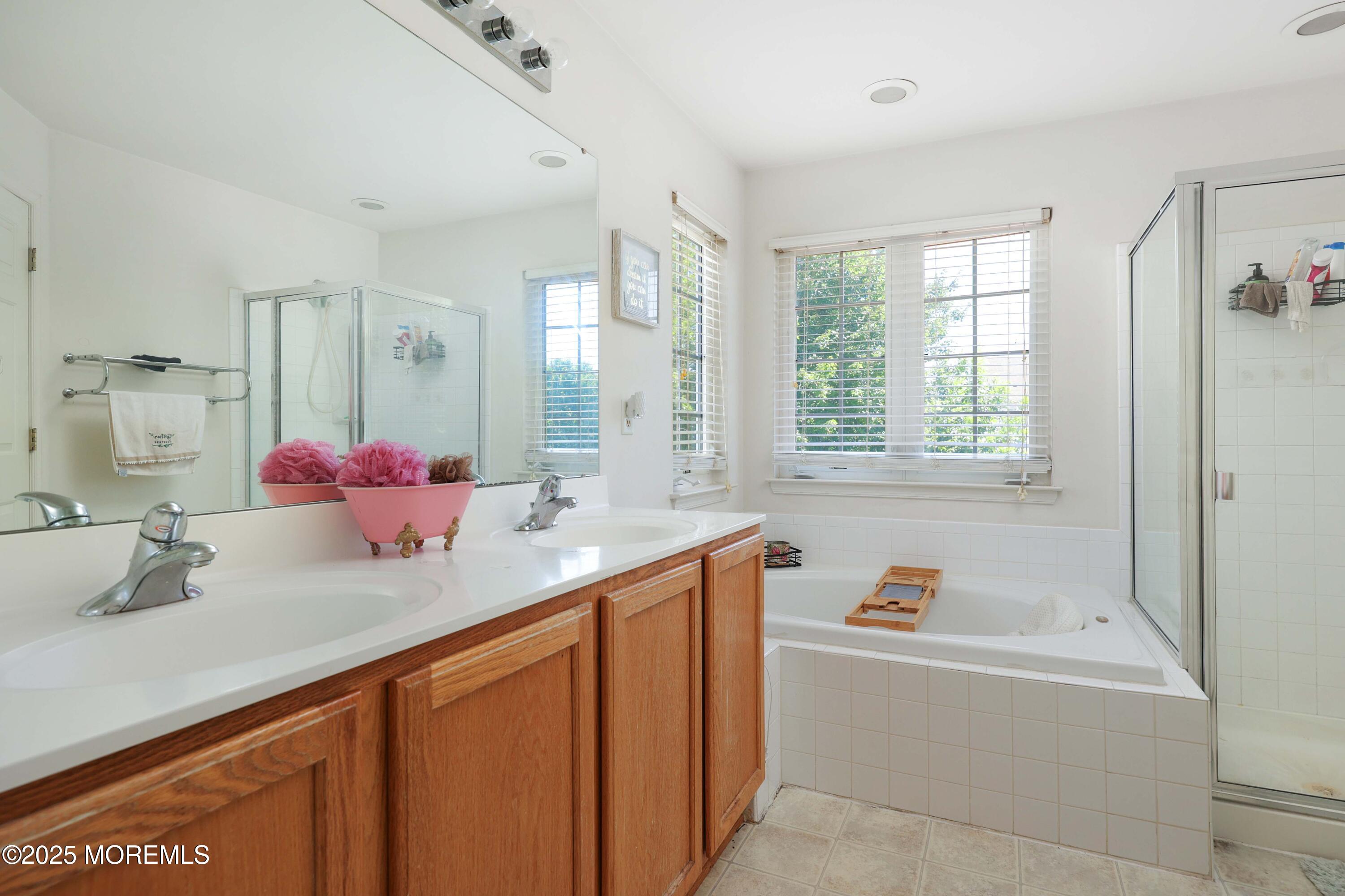 32 Firestone Drive Howell, NJ 07731 - Photo 22 of 43 a bathroom with a tub sink and mirror